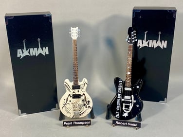 A Pair of AXMAN Miniature Electric Guitar Replicas