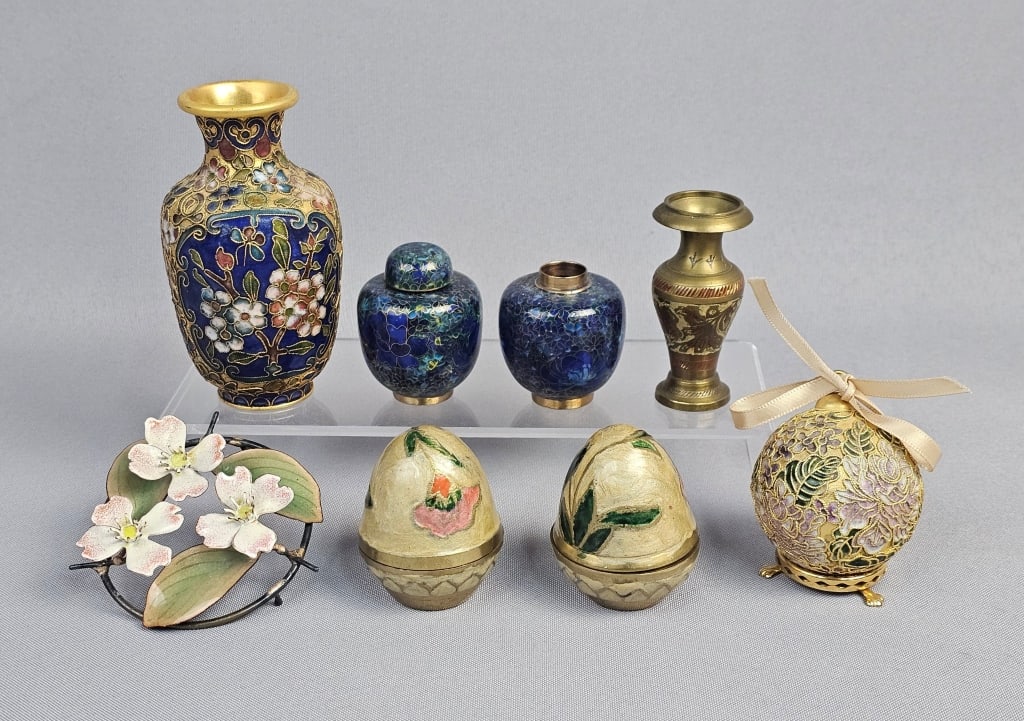 A Collection of Eight Chinese Cloisonn? and Enamel: A collection of eight decorative objects, predominantly of Asian style. Comprising a cloisonné vase, approximately 4 inches tall, with a flaring rim, featuring a deep blue enamel ground with po