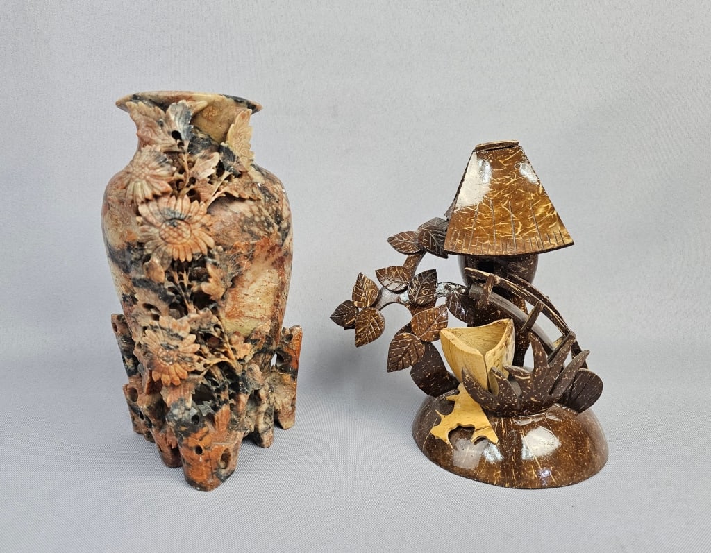 A Chinese Hand Carved Soapstone Vase and a Carved: This lot comprises two distinct decorative objects. The first is a Chinese hand carved soapstone vase, featuring intricate openwork carvings of floral and foliage motifs, resembling chrysanthemums, ac