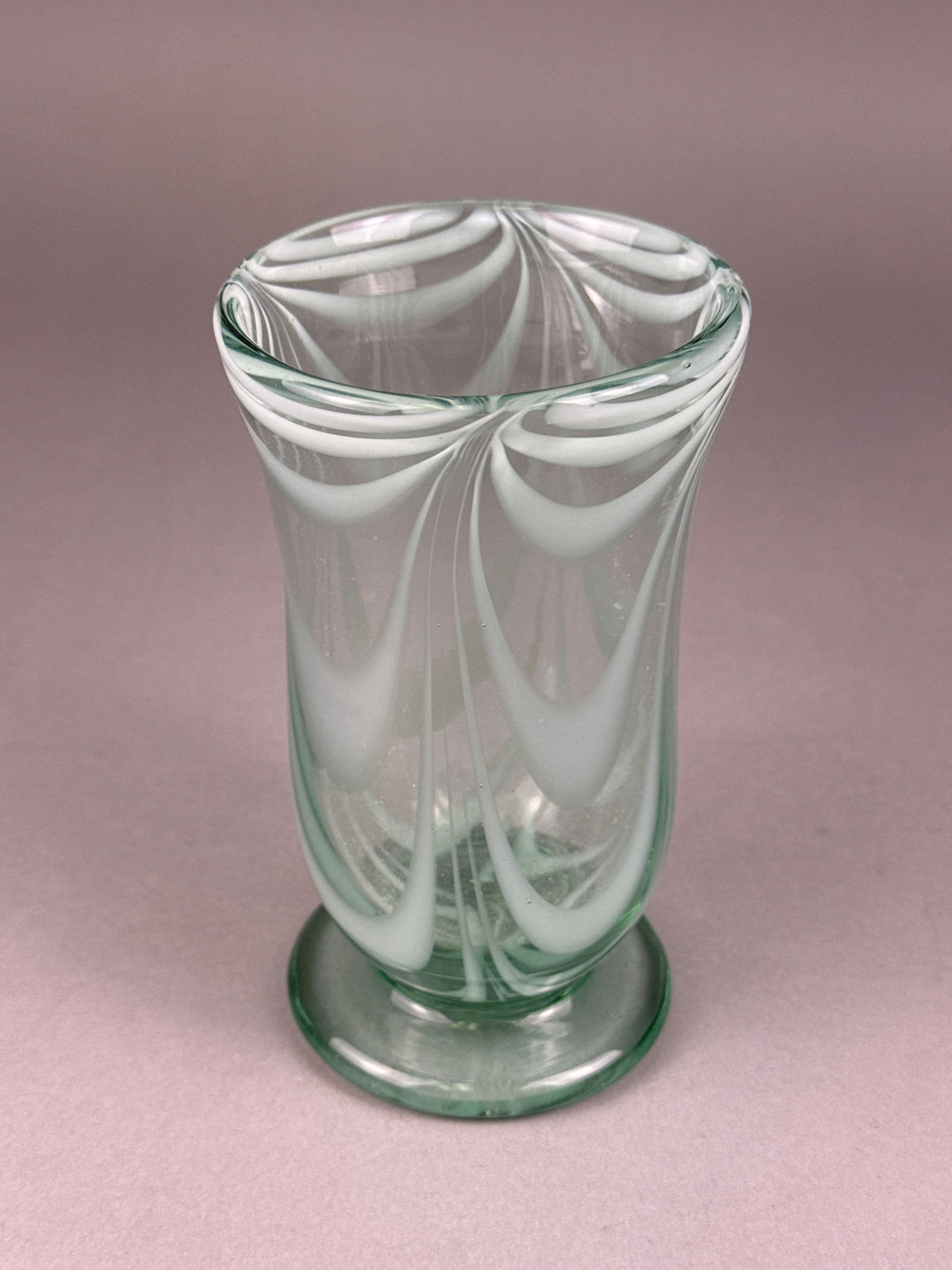 Metropolitan Museum of Art MMA Looped Art Glass Vase: A single art glass vase attributed to the Metropolitan Museum of Art (MMA) reproductions, featuring a design inspired by mid-century Murano glass, often associated with Seguso. The hand-blown vessel i