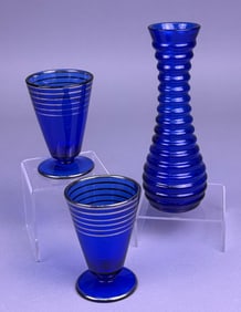 A Trio of Art Deco Style Cobalt Blue Glass, Comprising a Ribbed Vase and Two Gilt-Banded Stemmed