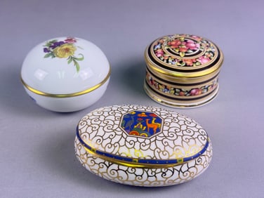 A Trio of Fine Bone China and Porcelain Lidded Trinket Boxes including Wedgwood Clio, AK Kaiser, and