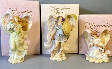 A Collection of Three Seraphim Classics Figurines by Roman Inc. including Michael Victorious