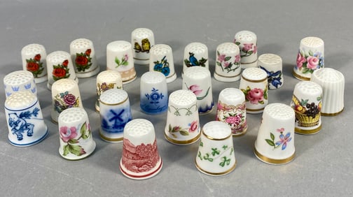 A Collection of 27 International Porcelain and Bone China Decorative Thimbles