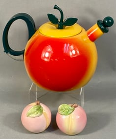 A Trio of Novelty Fruit Kitchenware, Including a Copco Apple Teapot and Russ Peach Shakers