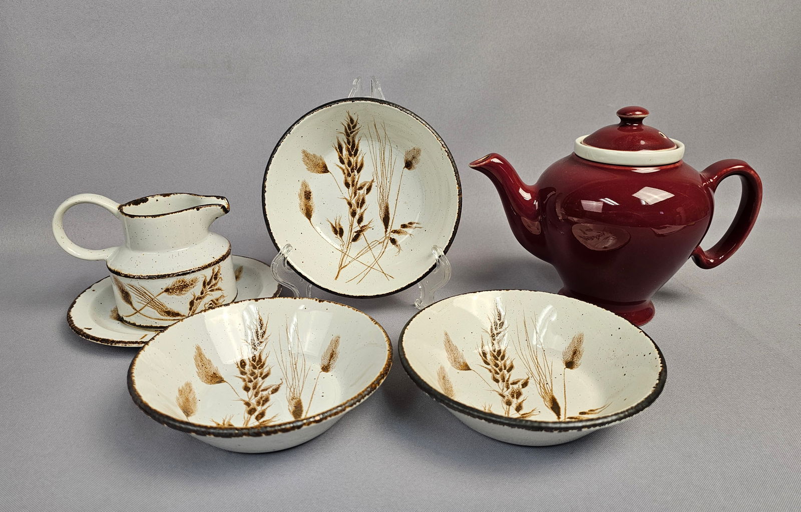 A Collection of 6: Hall McCormick Baltimore Teapot and Midwinter Stonehenge Wild Oats Stoneware: This collection comprises six pieces of vintage ceramic tableware, featuring two distinct patterns. The first group is a three-piece teapot set attributed to Hall for McCormick Tea Company of Baltimor