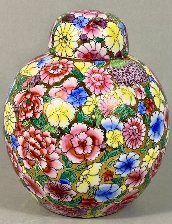 Chinese Hong Kong Hand Painted Ginger Jar: A vintage Chinese porcelain ginger jar, hand-painted in the 'Thousand Flowers' (Millefleur) pattern. The globular ceramic jar features a conforming domed lid and an all-over dense floral decoration. T
