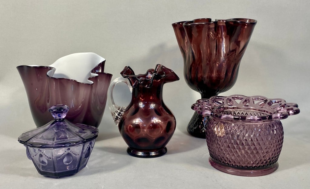 Fenton Amethyst Coin Dot Pitcher & More: The collection features a Fenton Amethyst Coin Dot Pitcher, hand-blown with a crimped or ruffled rim, a clear applied handle, and raised polka dot patterns. Also included are two ruffled vases, one fo