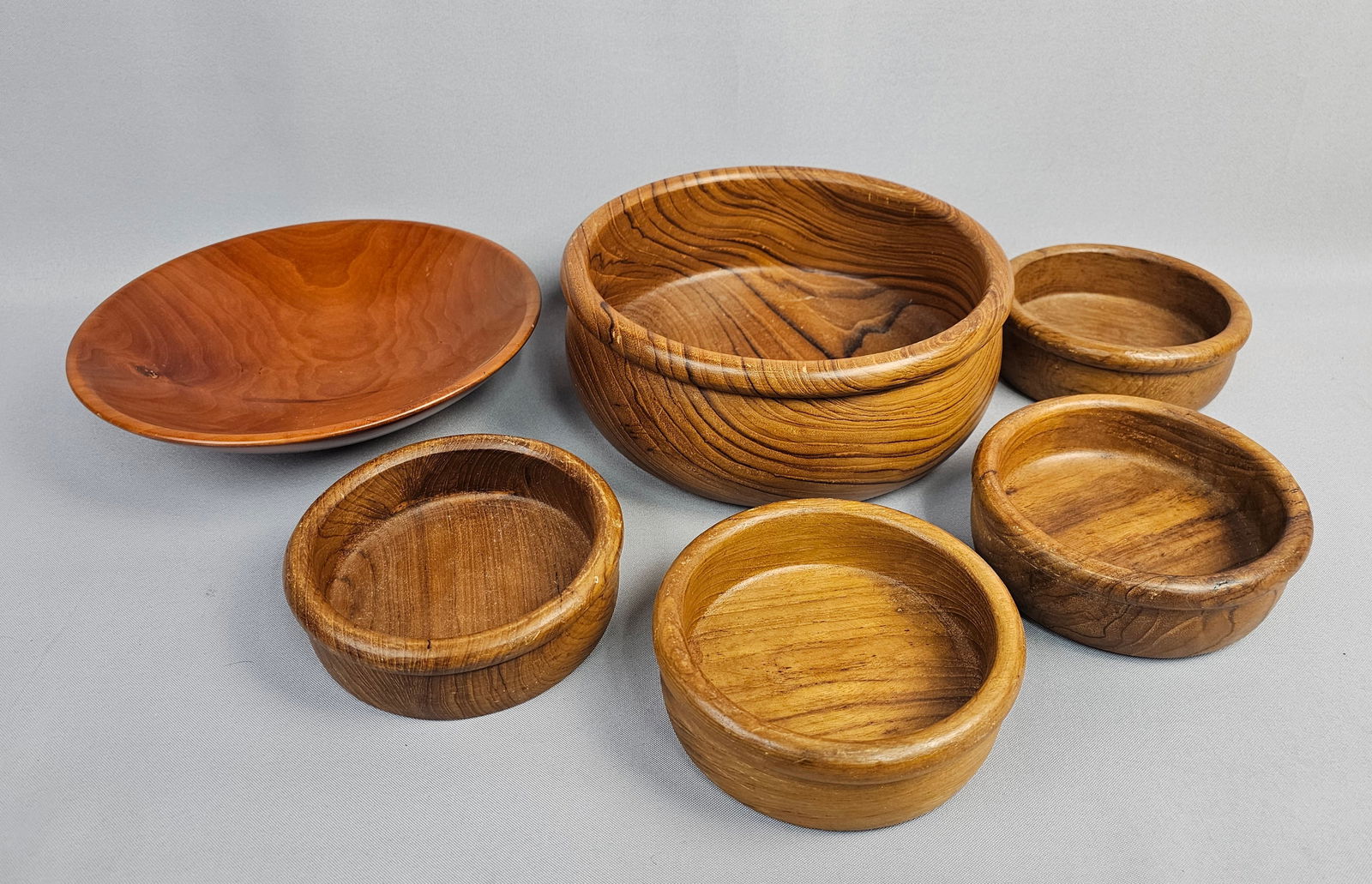 A Collection of Six Assorted Wooden Serving Vessels, Including a Teakwood Bowl Set (1 of 12)