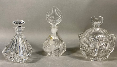 A Trio of Cut Lead Crystal Perfume Bottles and Covered Jar by Marquis by Waterford and Princess