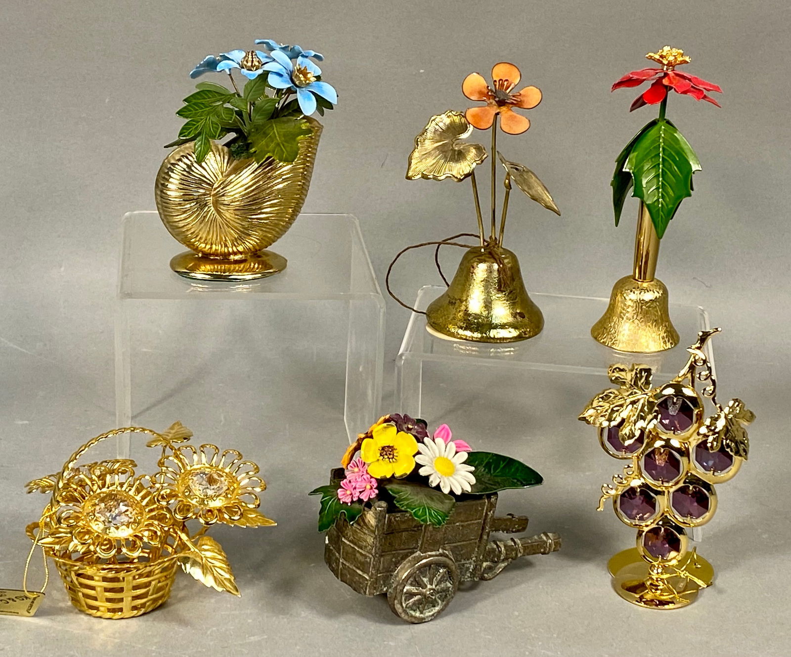 A Collection of Six Miniature Metal and Enamel Floral Sculptures, including Bovano and Crystal: A collection of six miniature decorative sculptures crafted primarily from metal, featuring extensive enamel work, gold plating, and crystal accents, dating to the mid-late 20th century. The collectio