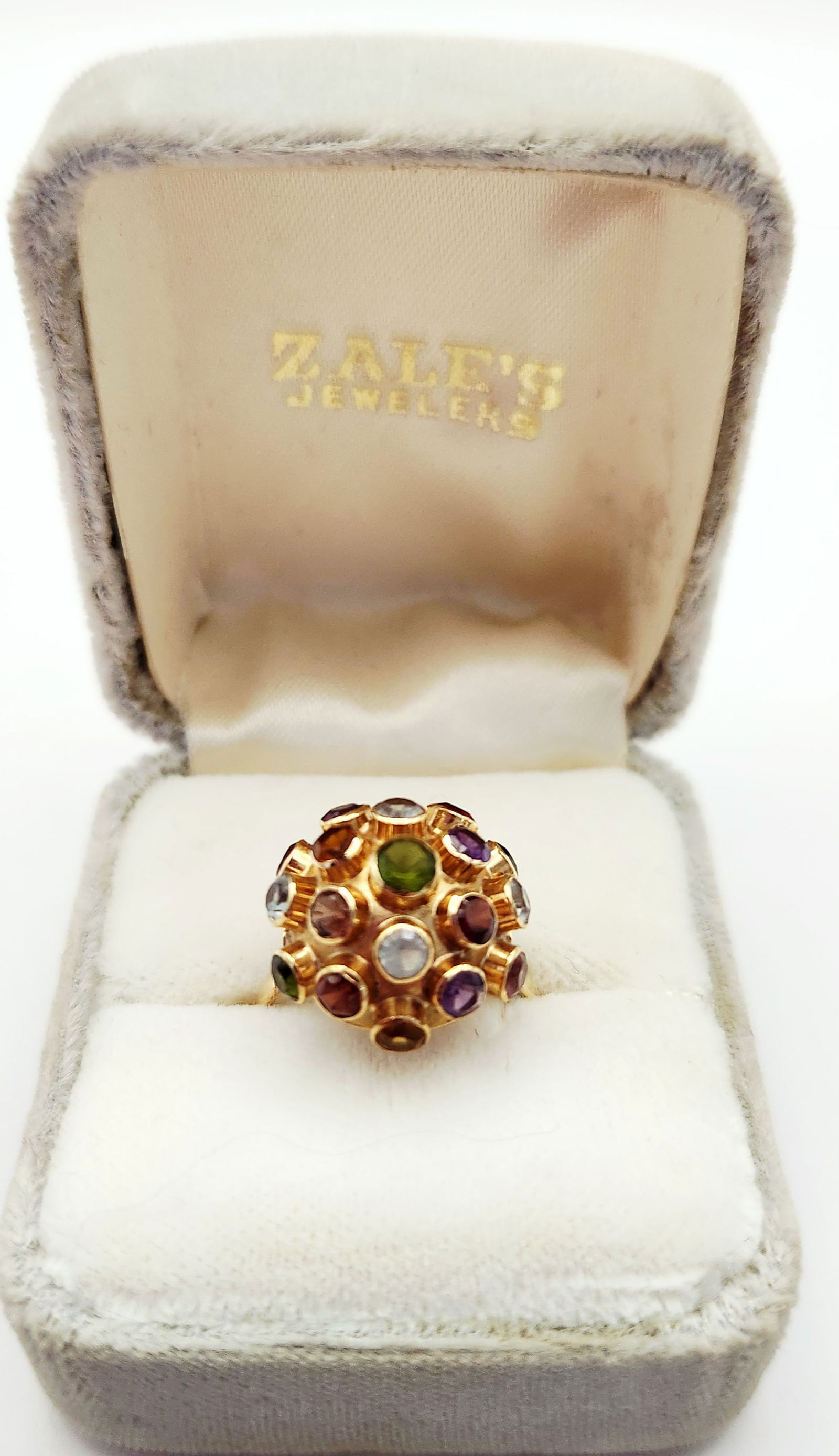 H. Stern 14K Gold Sputnik Ring 2.6 Grams: A vintage 18K yellow gold cocktail ring in the Sputnik design attributed to H. Stern. The ring features a raised domed cluster of various bezel-set, round faceted gemstones including amethyst, garnet,