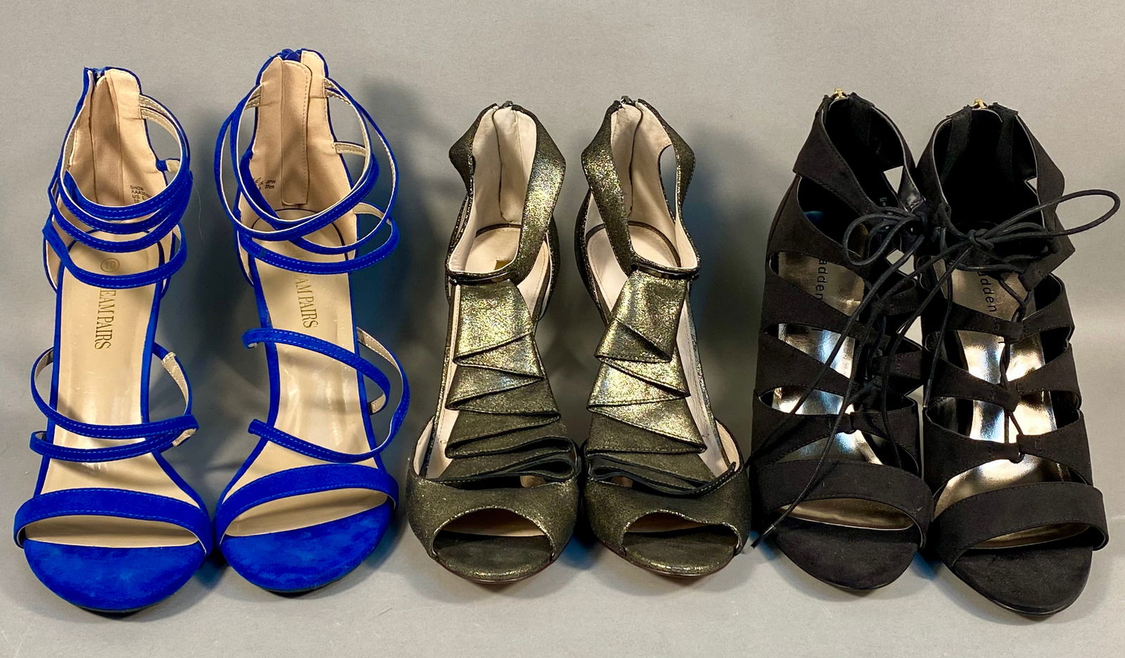 A Trio of Women's Stiletto Sandals by Madden Girl, Louise et Cie, and Dream Pairs: This collection consists of three pairs of contemporary stiletto-heeled sandals in a women's size 10. The group includes a pair of black faux-suede cage-style sandals by Madden Girl, model RACEYYY, fe