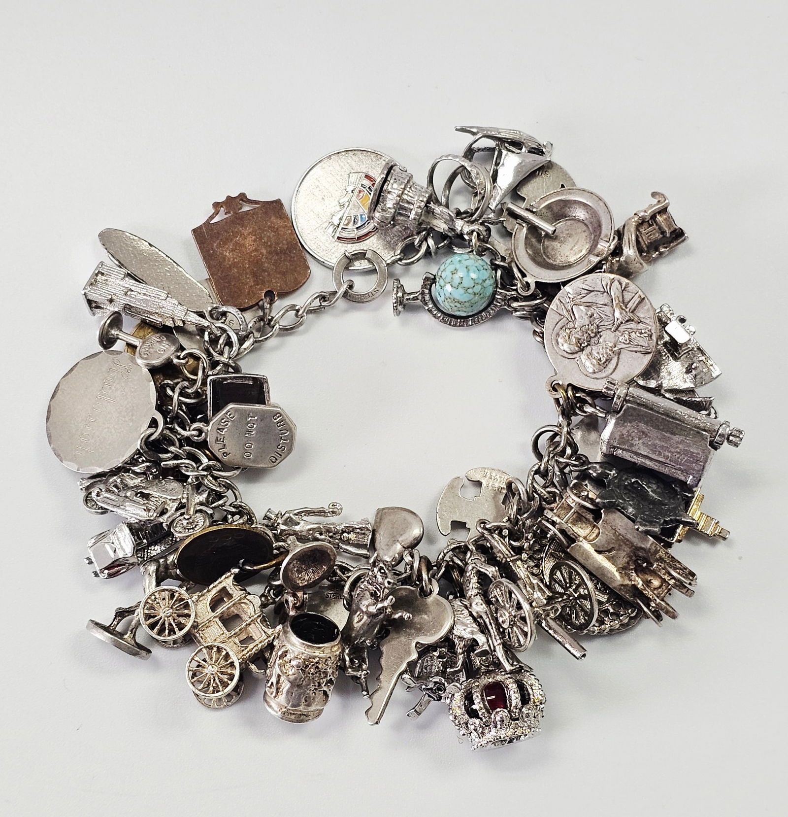 A Vintage Sterling Silver, 800 Silver, and 10K Gold Charm Bracelet (1 of 13)