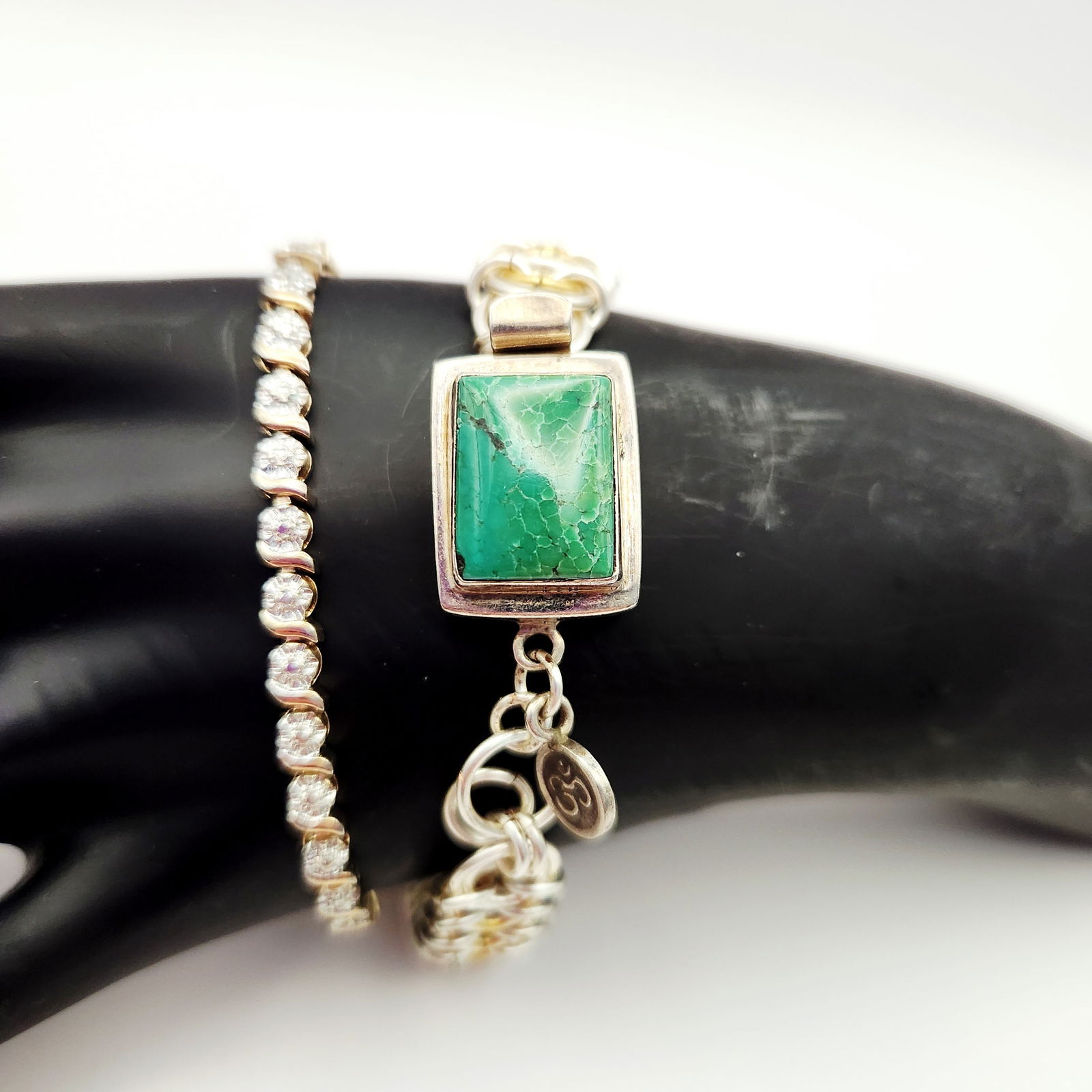 A Pair of Sterling Silver Bracelets including a Two-Tone Chainmail Bracelet and a Pave X-Link Tennis (1 of 9)