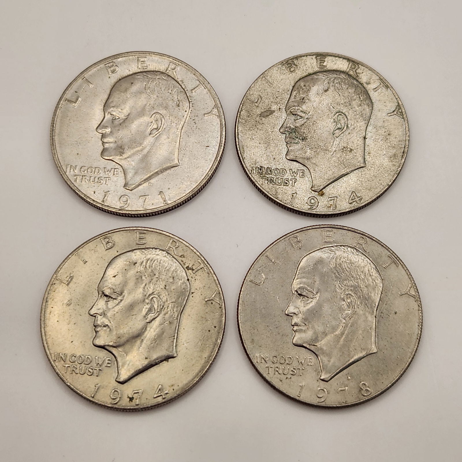 A Collection of Four United States Clad Eisenhower Dollar Coins (1 of 15)