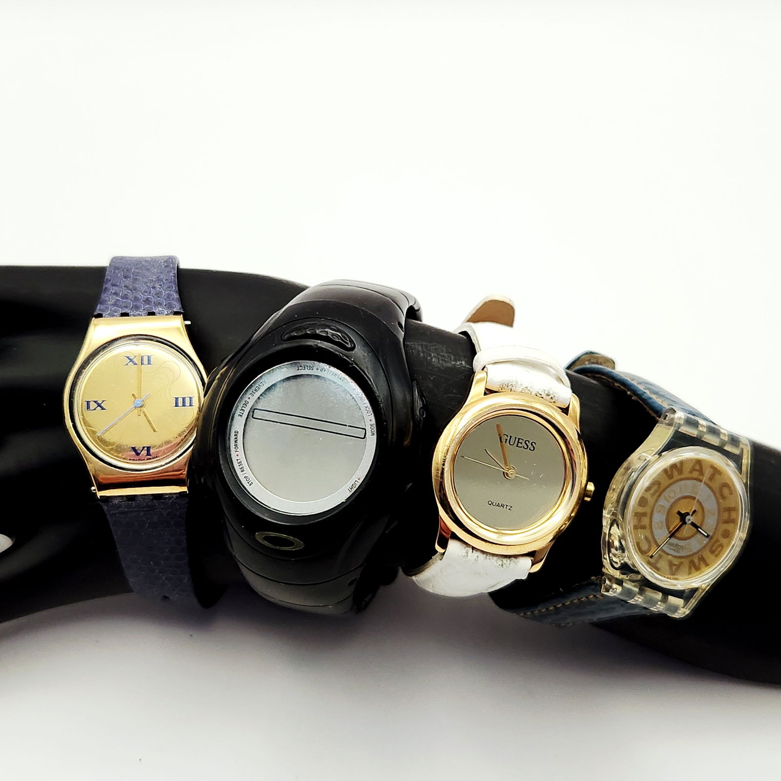 A Collection of 4 Swatch Guess and Oakley Wristwatches (1 of 20)