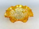 Northwood Marigold Carnival Glass Ruffled Bowl, Strawberry Pattern: A single antique or vintage Carnival Glass bowl manufactured by the Northwood Glass Company. The piece is executed in pressed glass with a vibrant Marigold iridescence displaying rich amber, gold, and