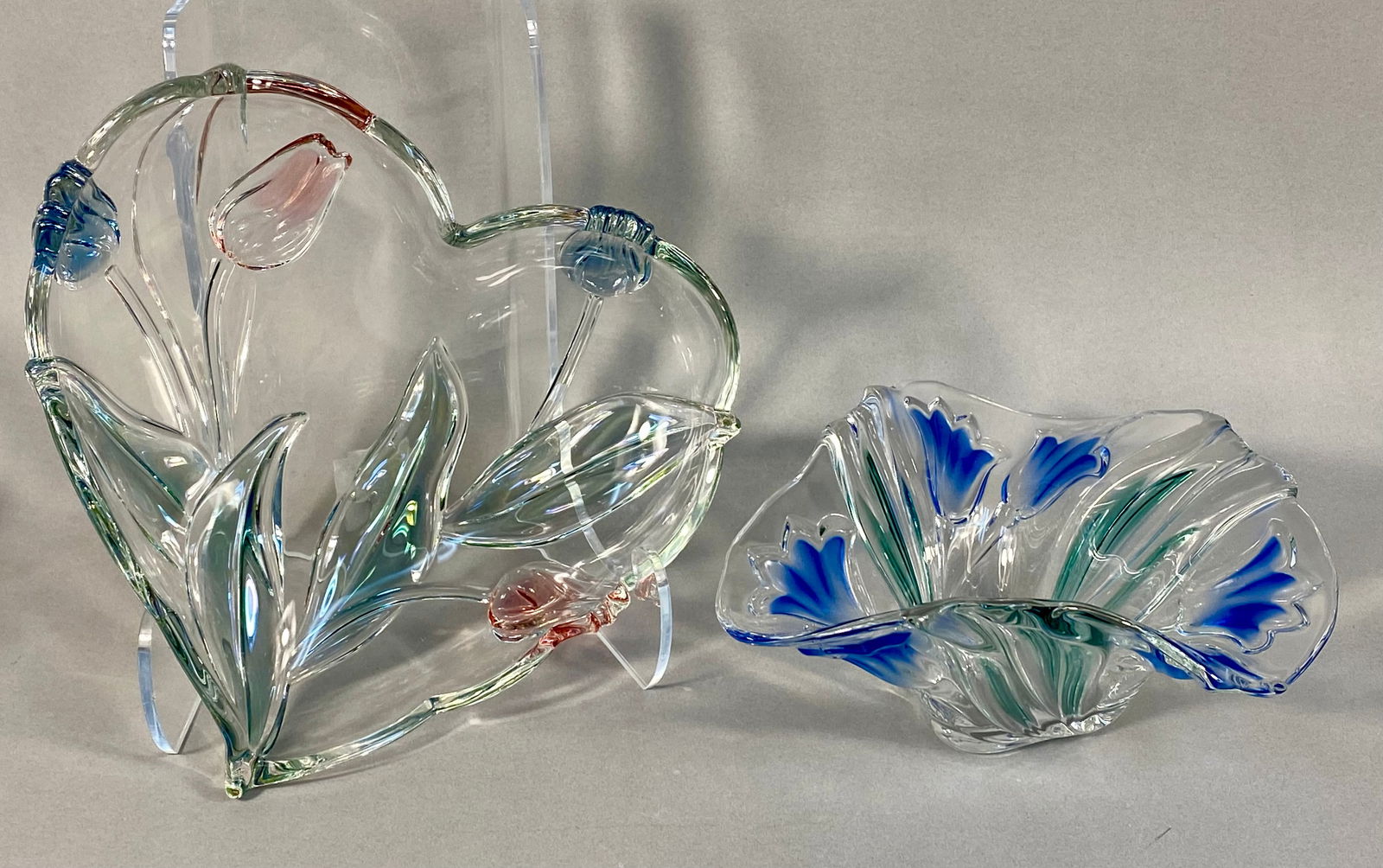 A Pair of Mikasa Tivoli Art Glass Dishes: A pair of decorative art glass items attributed to Mikasa in the Tivoli pattern, consisting of one large heart-shaped dish and one smaller, asymmetrical bowl. Both items are constructed from thick, cl