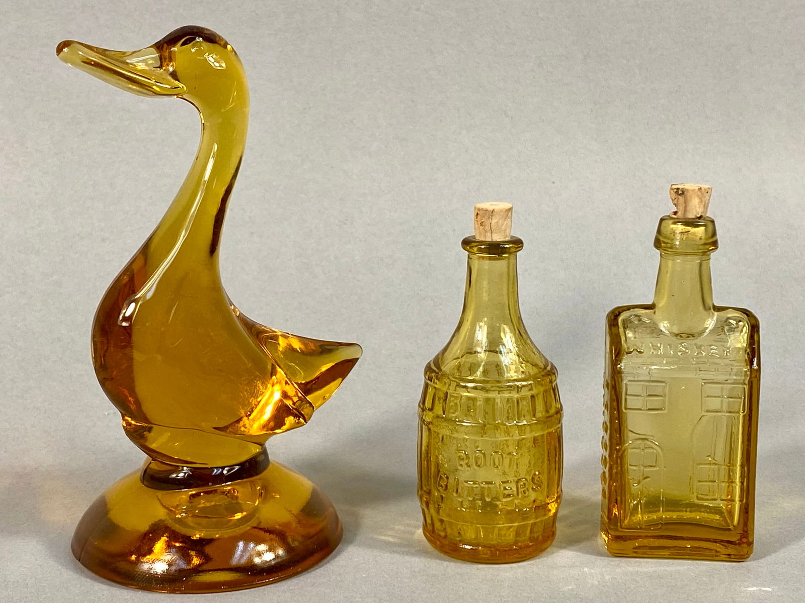 A Trio of Viking Glass Amber Duck Figurine and Two Wheaton Reproduction Bottles (1 of 11)