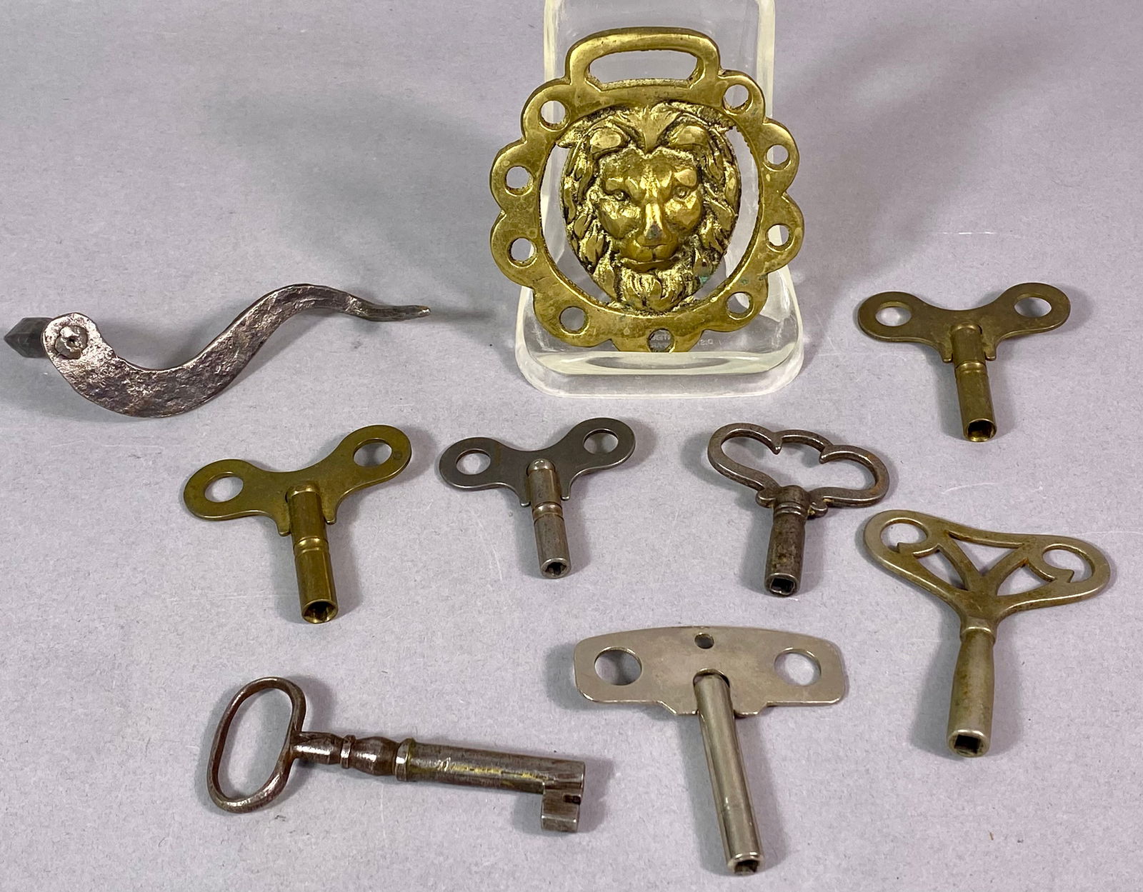 A Lion's Head Horse Brass and a Collection of Vintage Winding Keys (1 of 5)