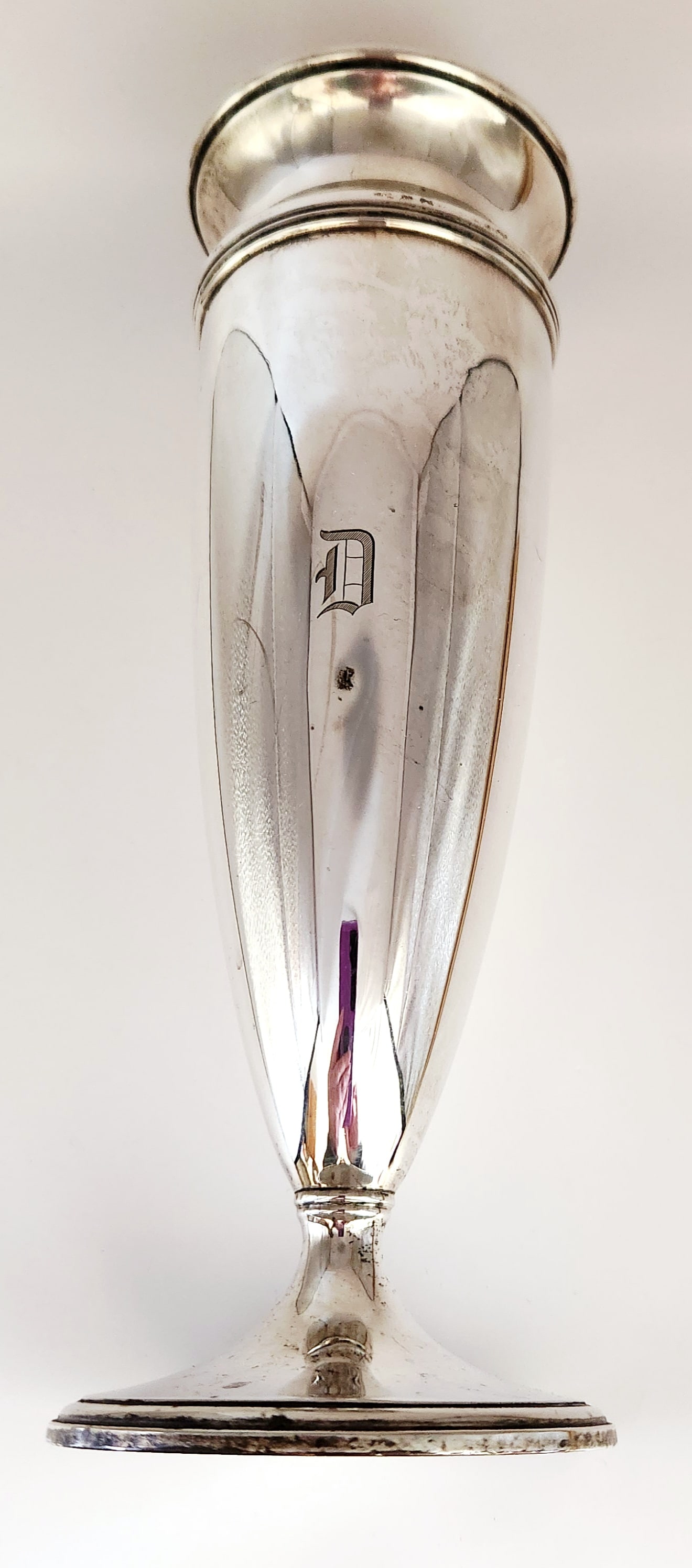 Tiffany & Co. Sterling Trumpet Vase 20.6 Ounces: A Tiffany & Co. sterling silver trumpet vase featuring a tapered body and a flared circular pedestal foot. The piece is designed with a molded rim and a polished silver surface. A single Old Engli