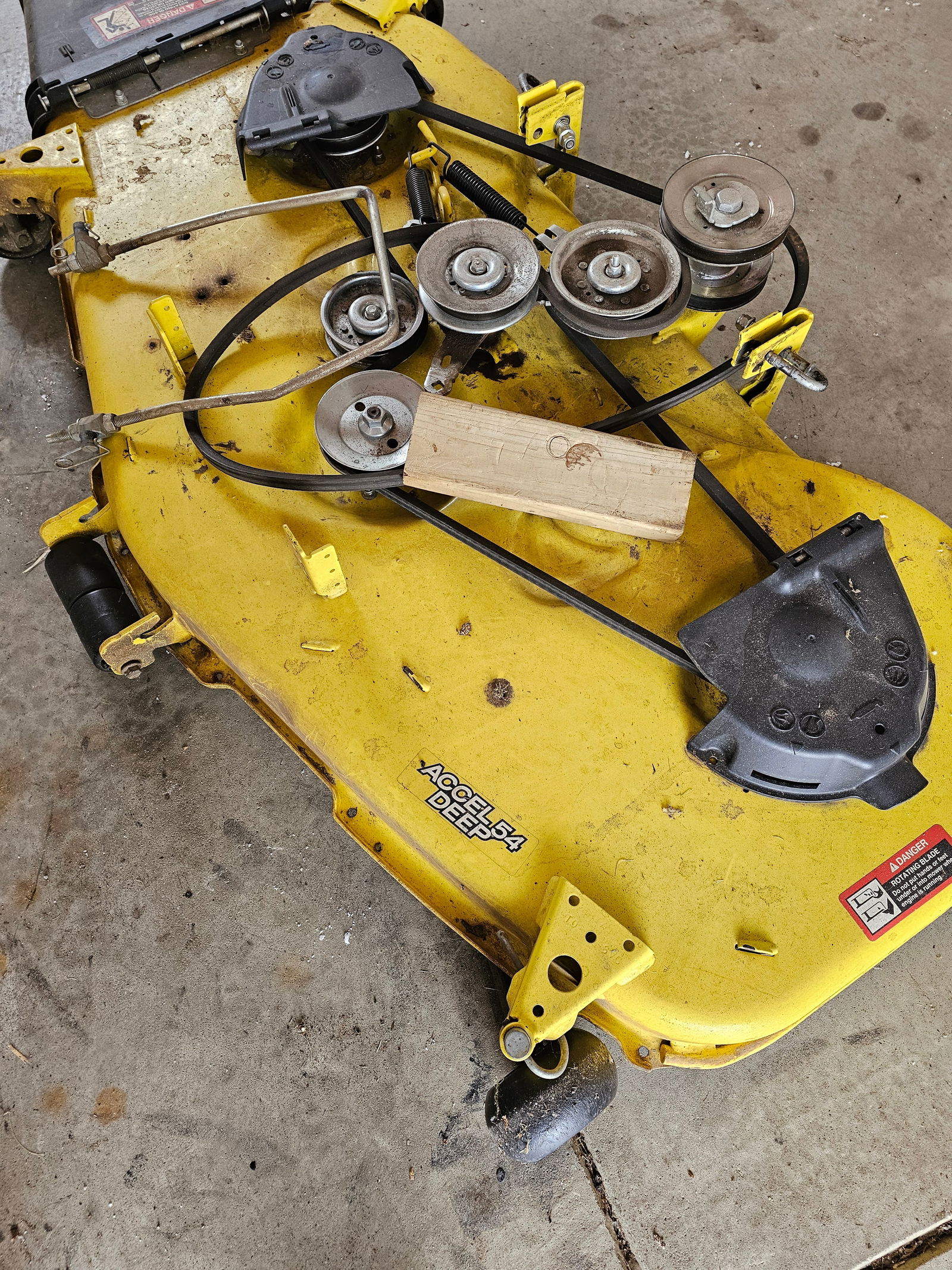 John Deere 54-Inch Accel Deep Mower Deck: Lot #10-20 are located and MUST be picked up in Eaton Rapids, MI on Tuesday, March 3rd, 2026. NO EXCEPTIONS The item shows evidence of previous use, including accumulated surface dirt and dried