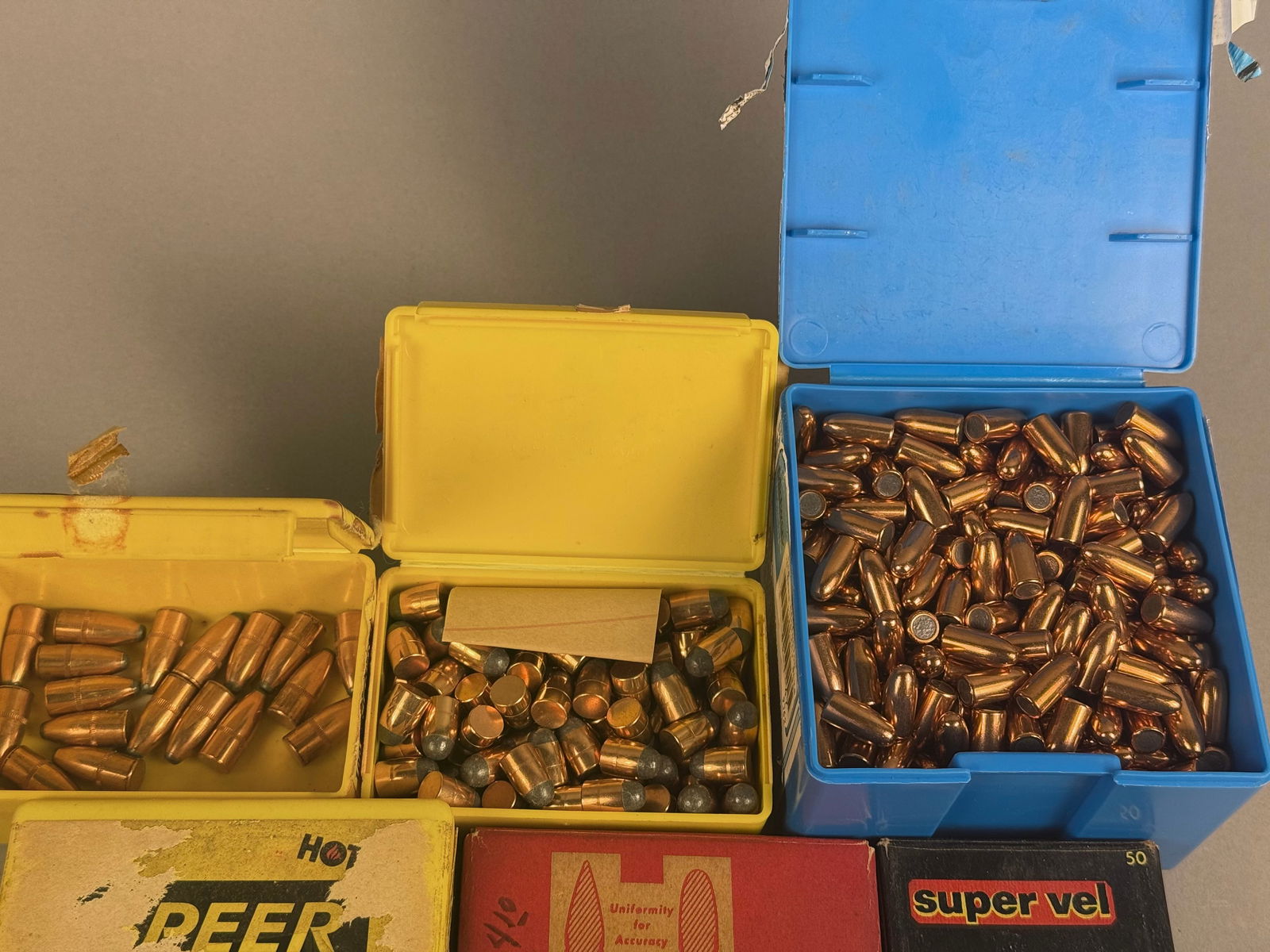 An Assortment of Reloading Projectiles from Various Manufacturers: An assortment of reloading projectiles from various manufacturers including Speer, Hornady, Sierra, Super Vel, Norma, and Midway. The collection includes a variety of calibers and weights, such as