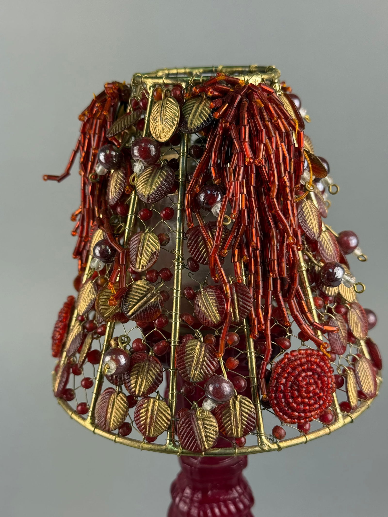 A Ruby Red Pressed Glass Candlestick with Beaded Wirework Shade - 2