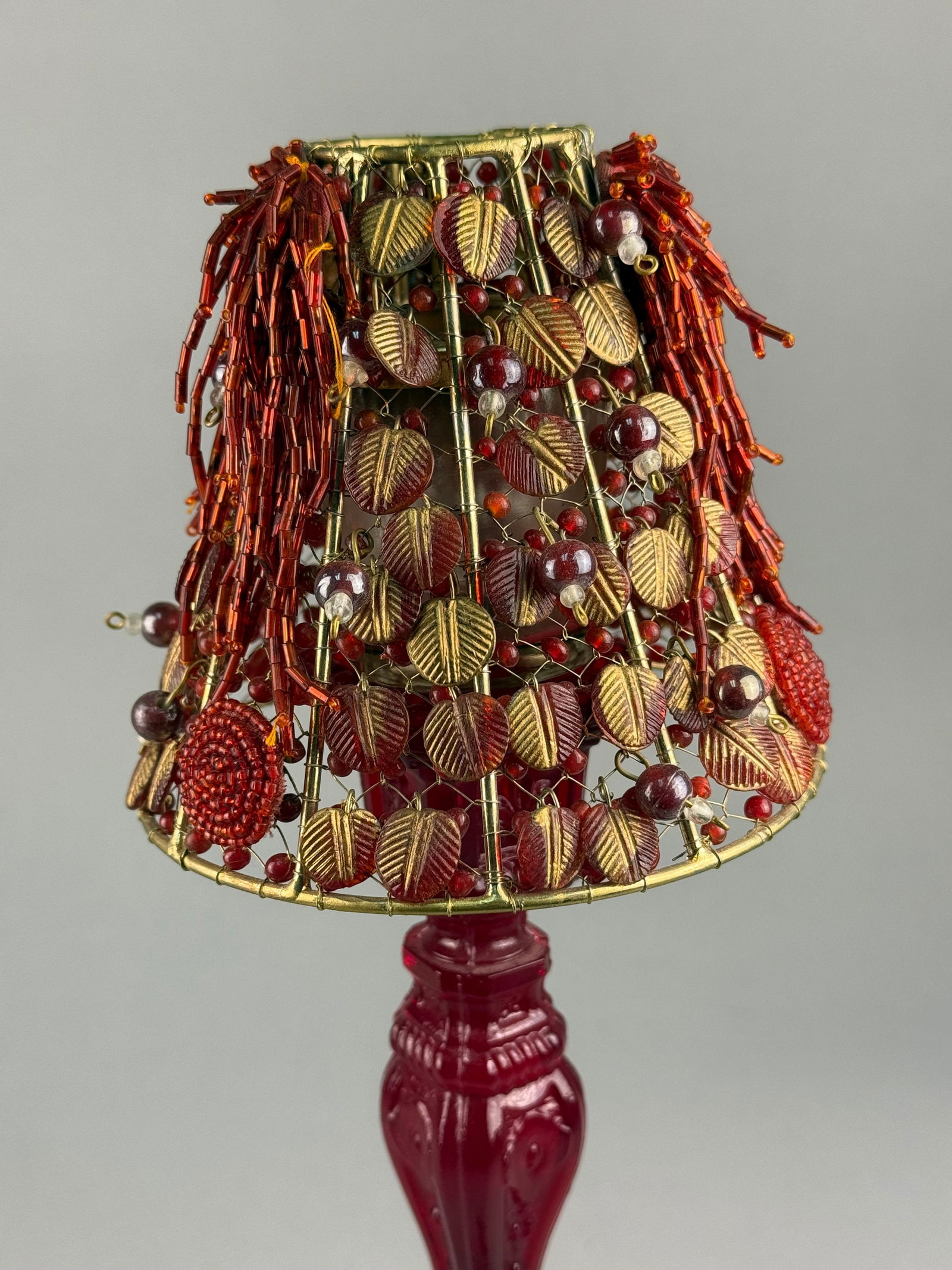 A Ruby Red Pressed Glass Candlestick with Beaded Wirework Shade - 3