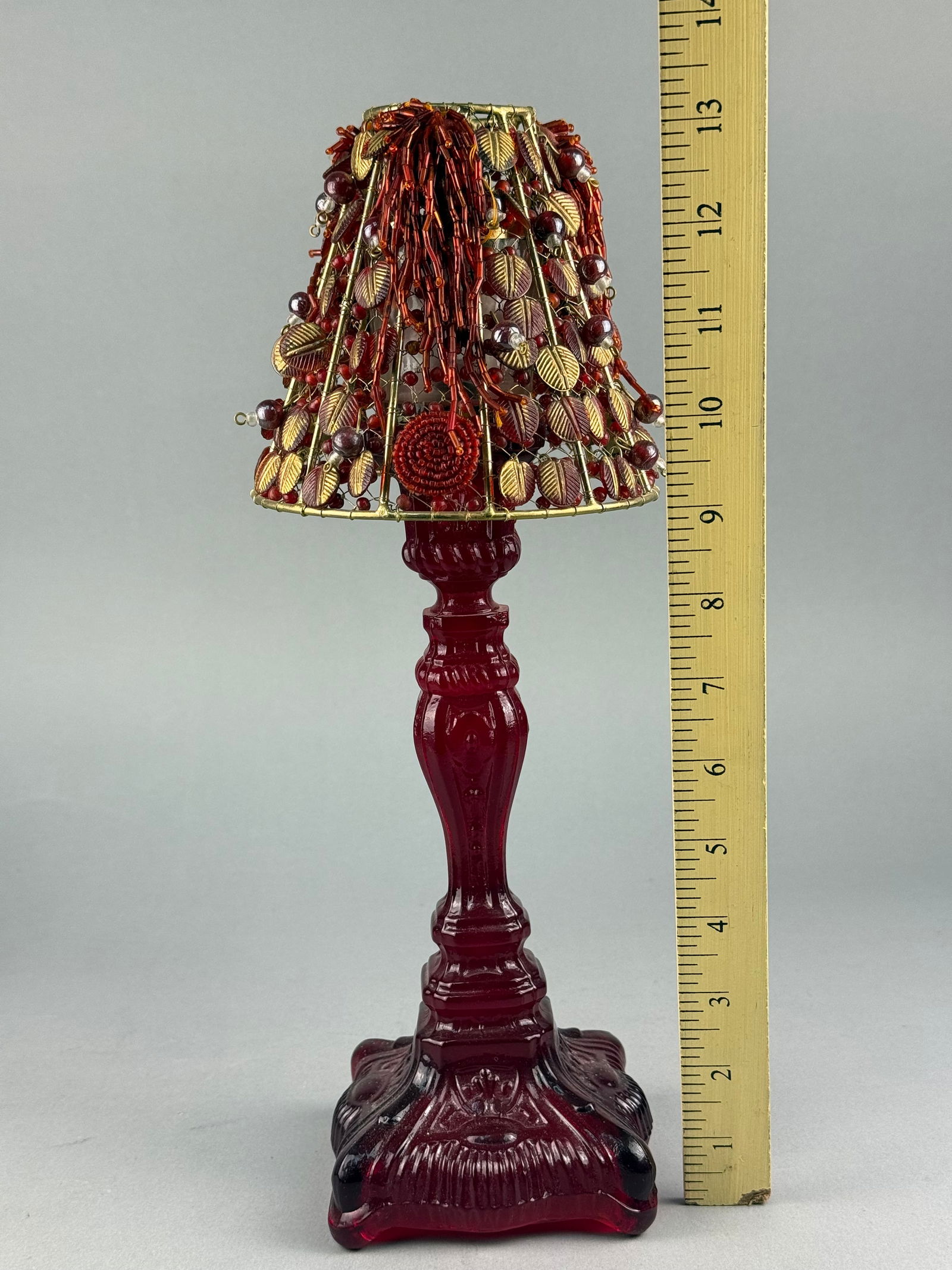 A Ruby Red Pressed Glass Candlestick with Beaded Wirework Shade - 7