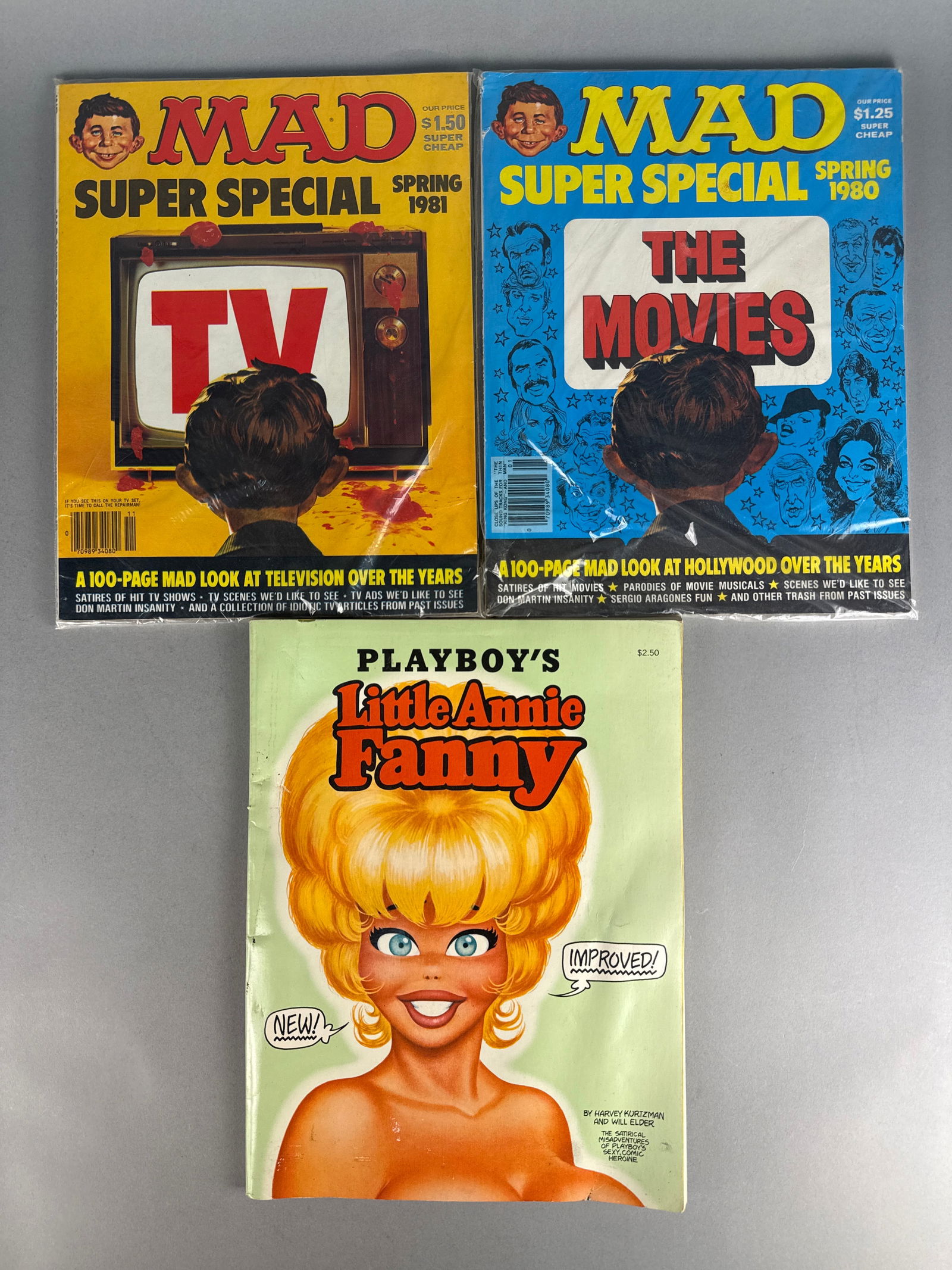A Trio of Vintage Satirical Magazines Including Playboy's Little Annie Fanny and MAD Super Specials: Playboy's Little Annie Fanny by Harvey Kurtzman and Will Elder, featured alongside two MAD Super Special issues. The MAD Super Special issues include the Spring 1980 edition titled The Movies and the