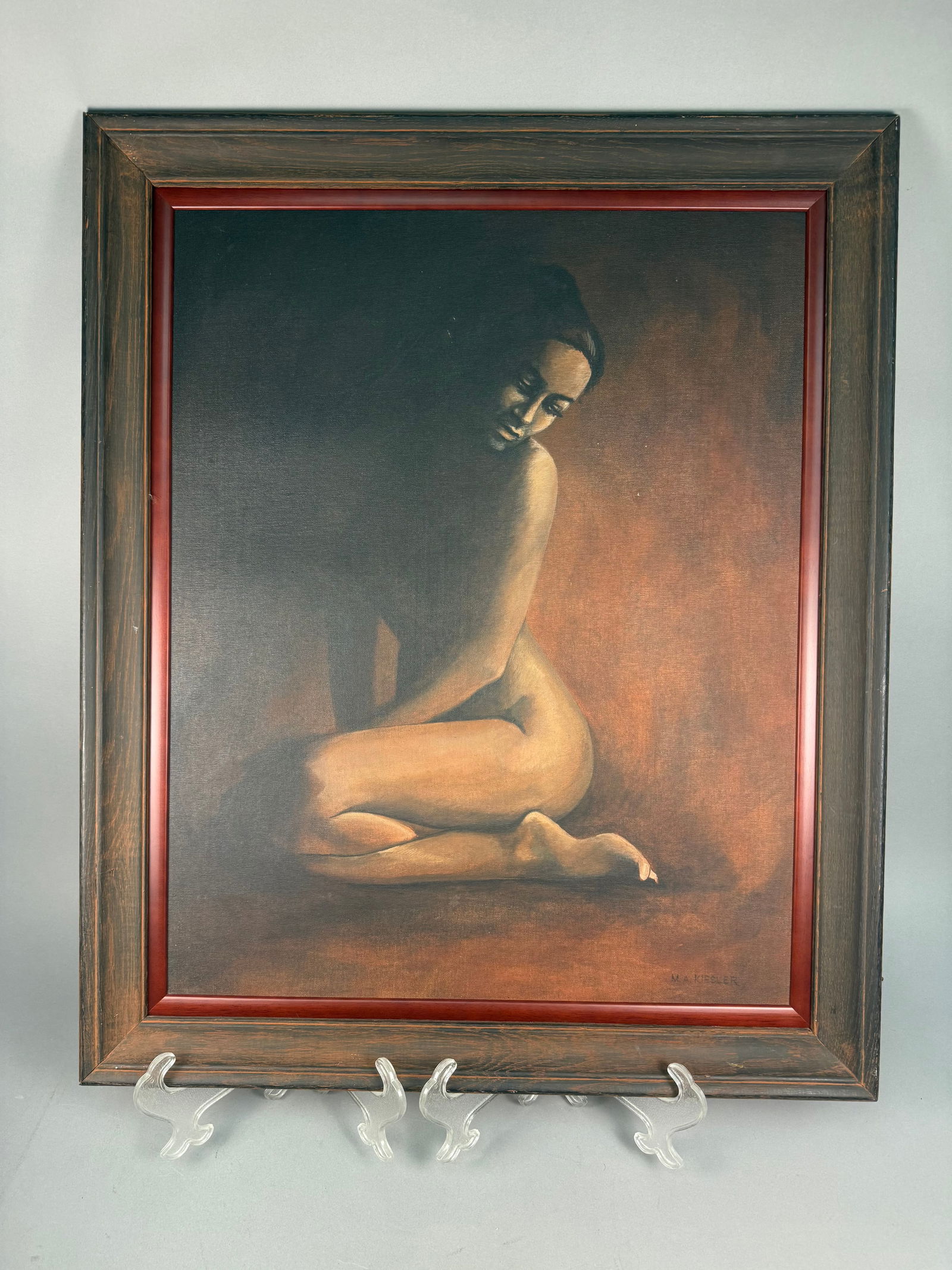 M.A. Kiesler, Reclining Nude, Oil on Canvas: An original painting on canvas depicting a reclining female nude, signed M.A. KIESLER in the lower right. The work is executed in a stylized manner, utilizing a warm tonal palette and chiaroscuro effe