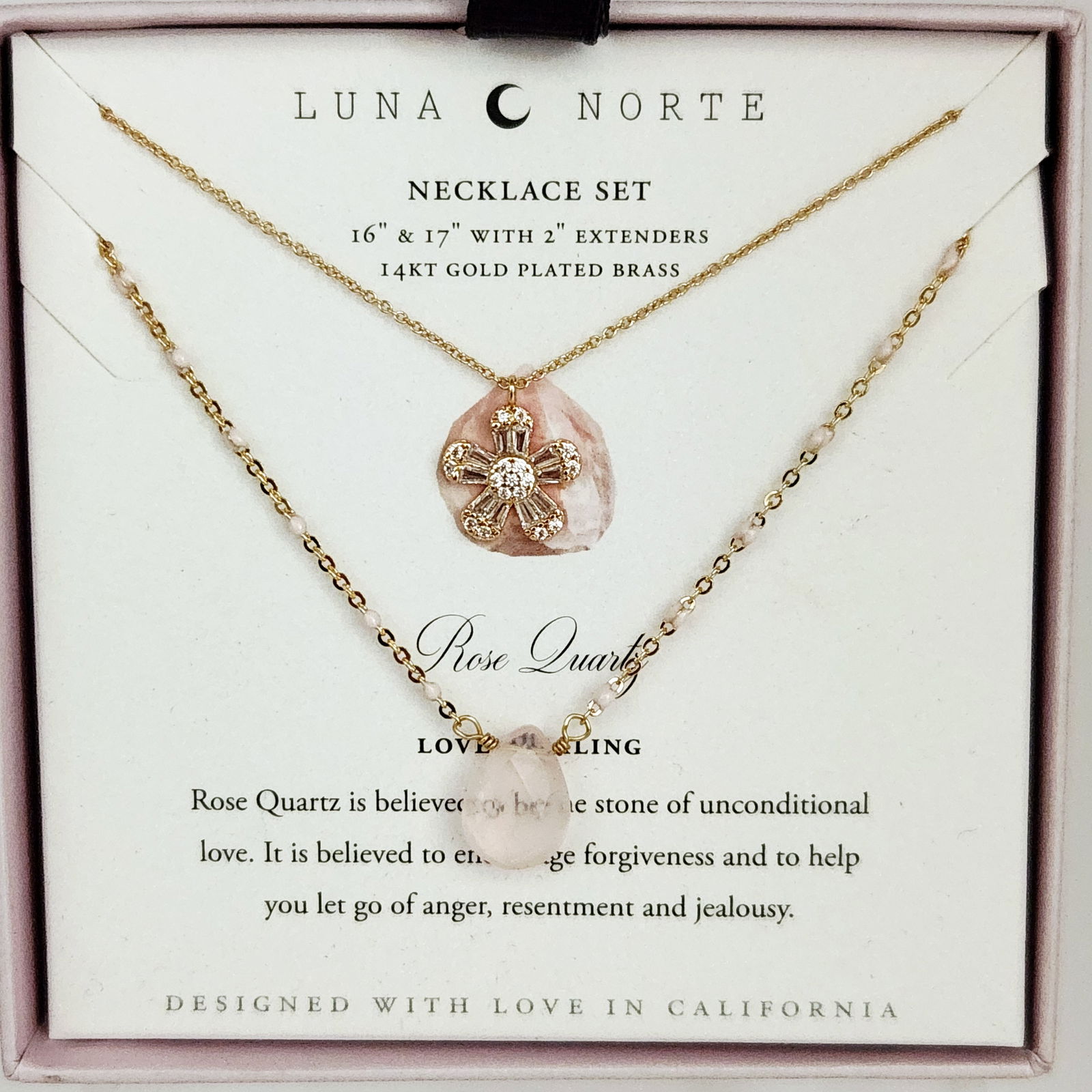 Luna Norte 14KT Gold-Plated Brass & Rose Quartz Necklaces: This necklace set by Luna Norte consists of two contemporary necklaces crafted from 14KT gold-plated brass. The first necklace features a gold-tone floral-motif pendant set with clear faceted stones o