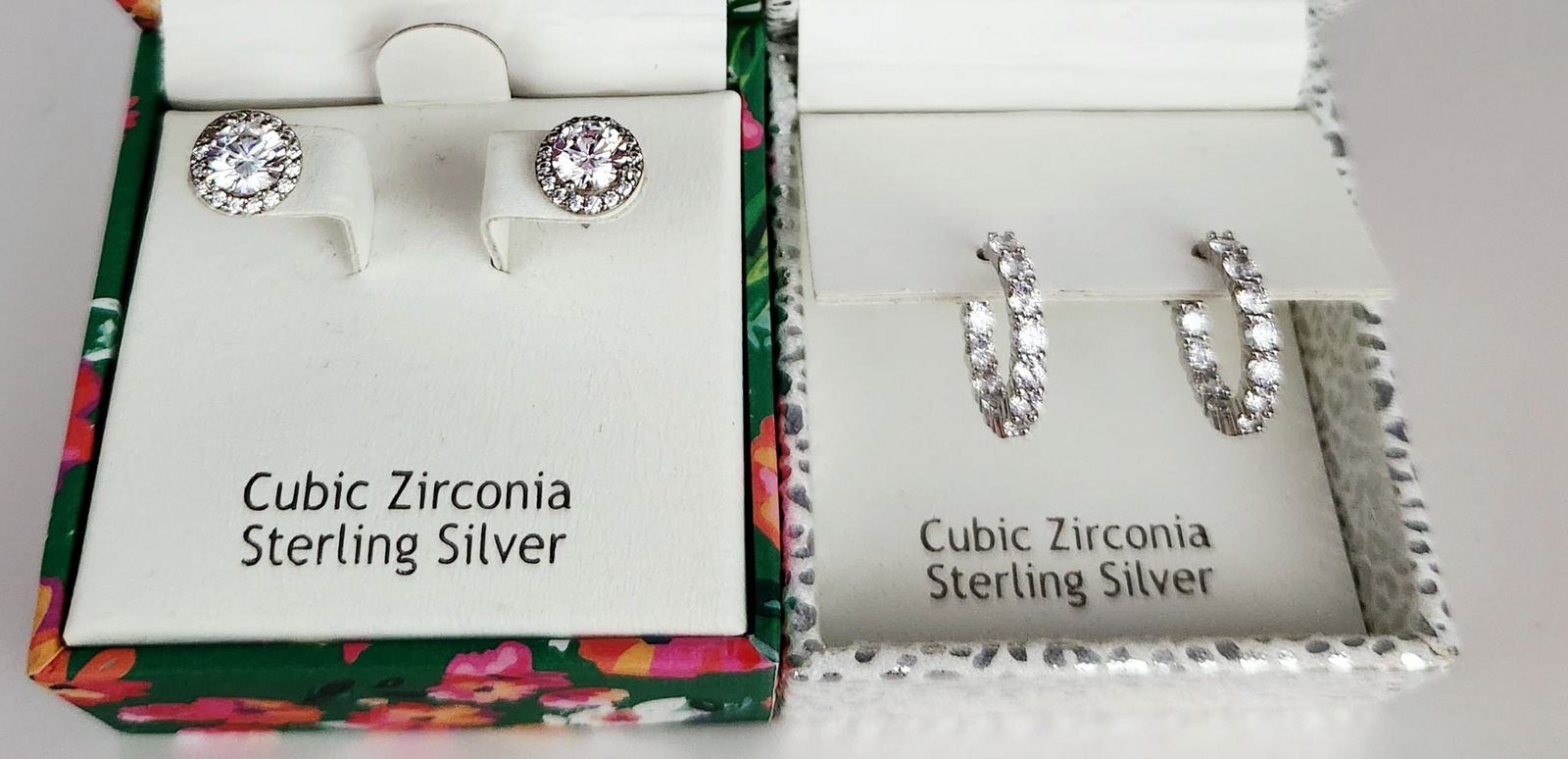 Nanette Lepore Sterling CZ Earrings 5.6 Grams: A collection of Nanette Lepore jewelry featuring two pairs of earrings. The grouping includes a pair of halo-style stud earrings, each set with a large central round-cut cubic zirconia stone encircled