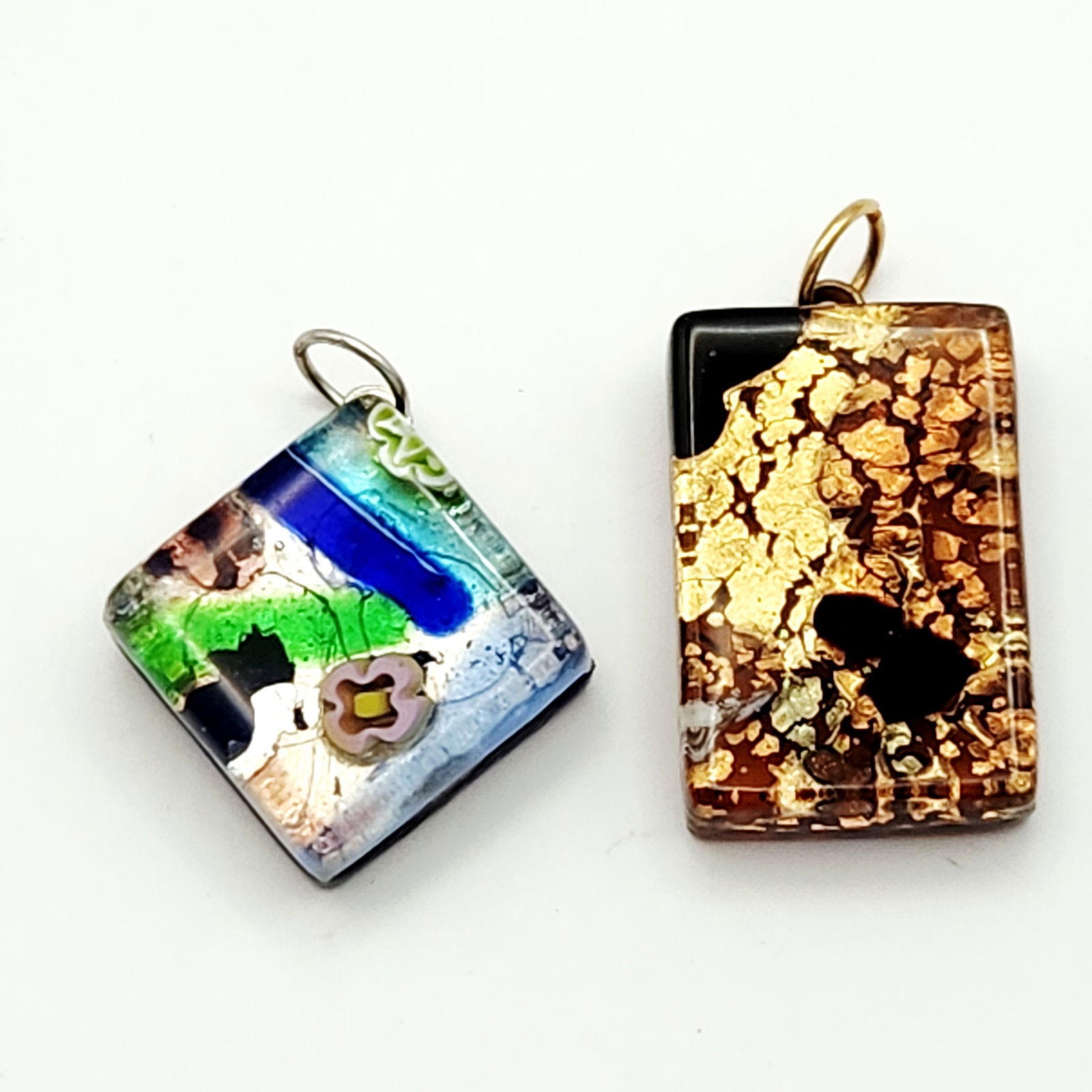 Murano Glass Pendants: A collection of jewelry and decorative elements featuring Murano glass pendants. The glass pendants consist of rectangular and square forms, each utilizing artisan glass making techniques including go