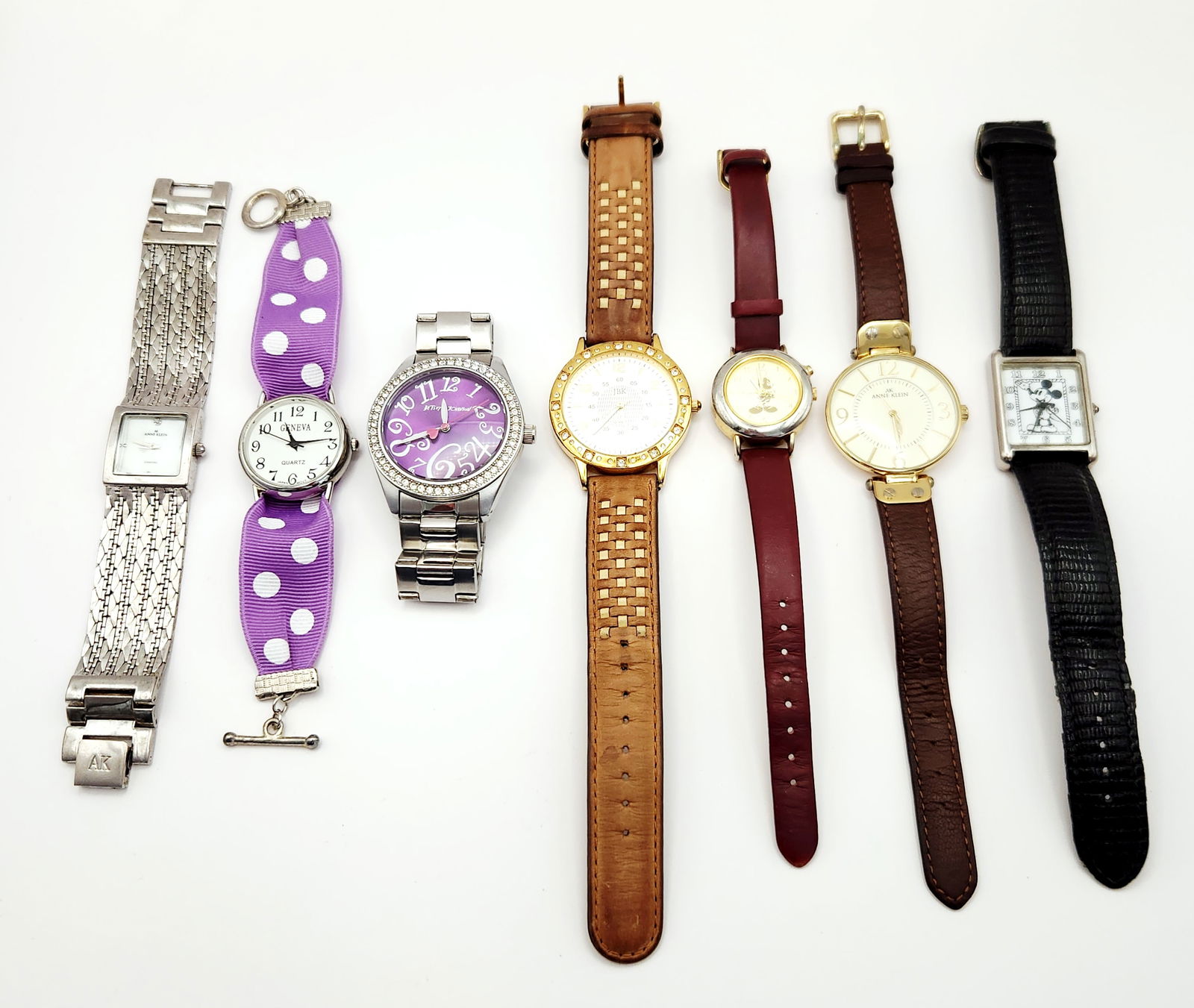 Collection of Fashion Watches Including Camrose & Kross JBK Collection: A collection of contemporary fashion wristwatches featuring a Camrose and Kross JBK Collection model. The group includes Anne Klein watches, featuring a silver-tone textured band with a diamond-accent