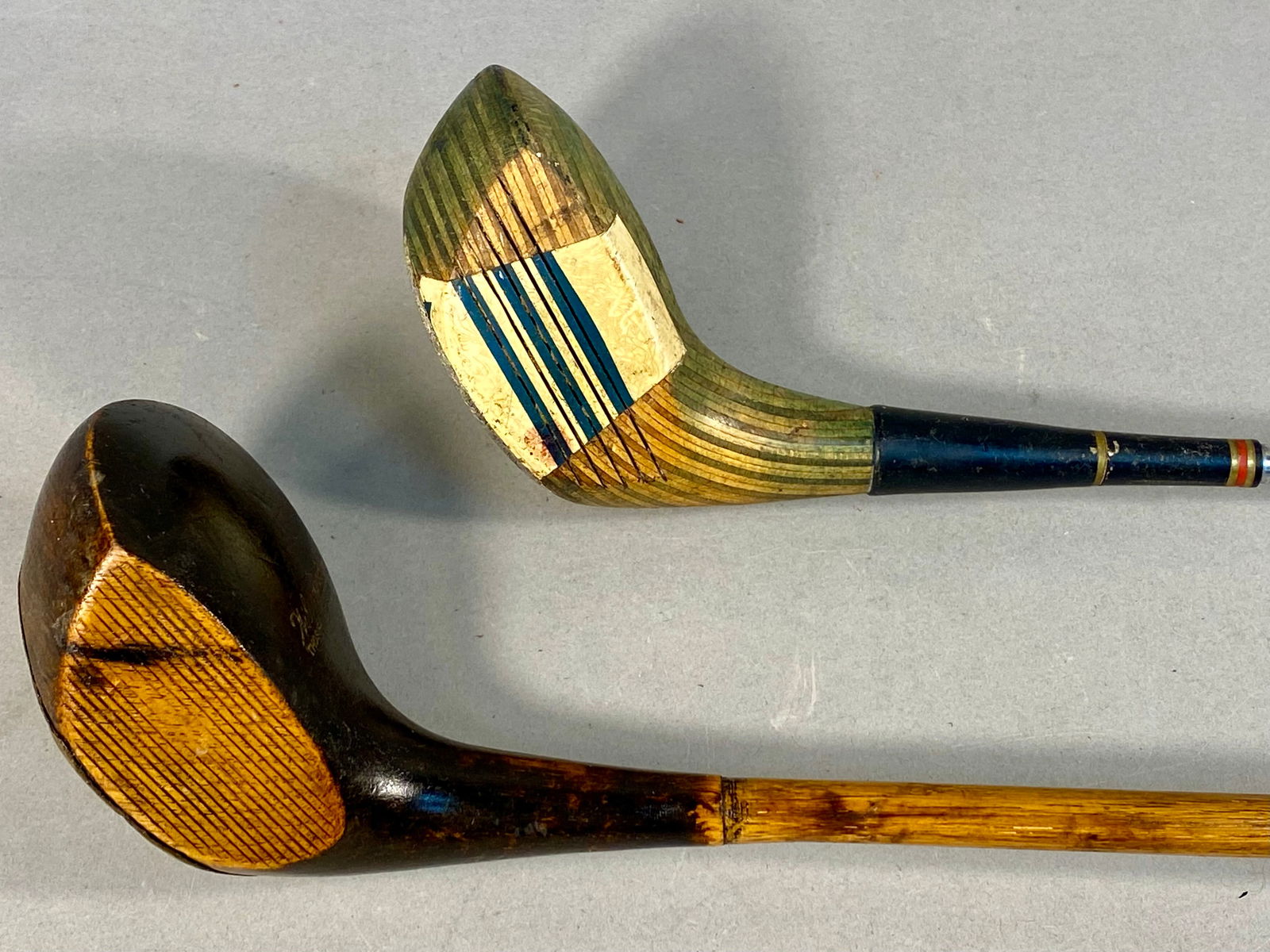 Two Vintage Golf Wood Clubs Including a Betty Jameson Northwestern Driver and a Wilsonian Ladies: This lot features two vintage golf wood clubs of differing eras and constructions. The first is a mid-century Northwestern No. 1 driver with a green-tinted laminated wood head, signed on the crown Bet