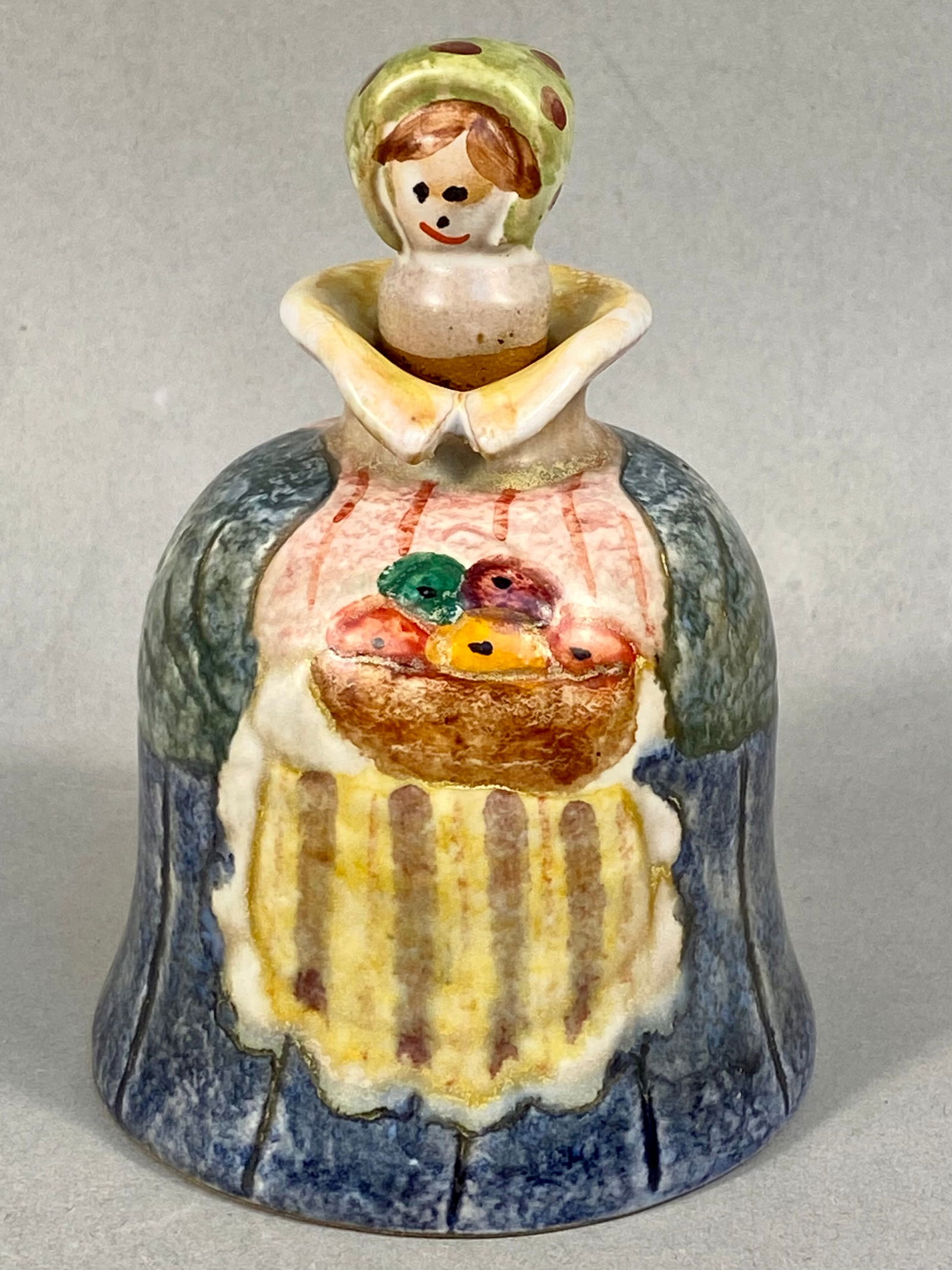 Italica Ars Mid-Century Modern Hand-Painted Ceramic Peasant Woman Figural Bottle: This mid-century Italian hand-painted ceramic figural bottle was produced by Italica Ars. The piece features a bell-shaped body and a removable stopper. The stopper is fashioned as a stylized peasant