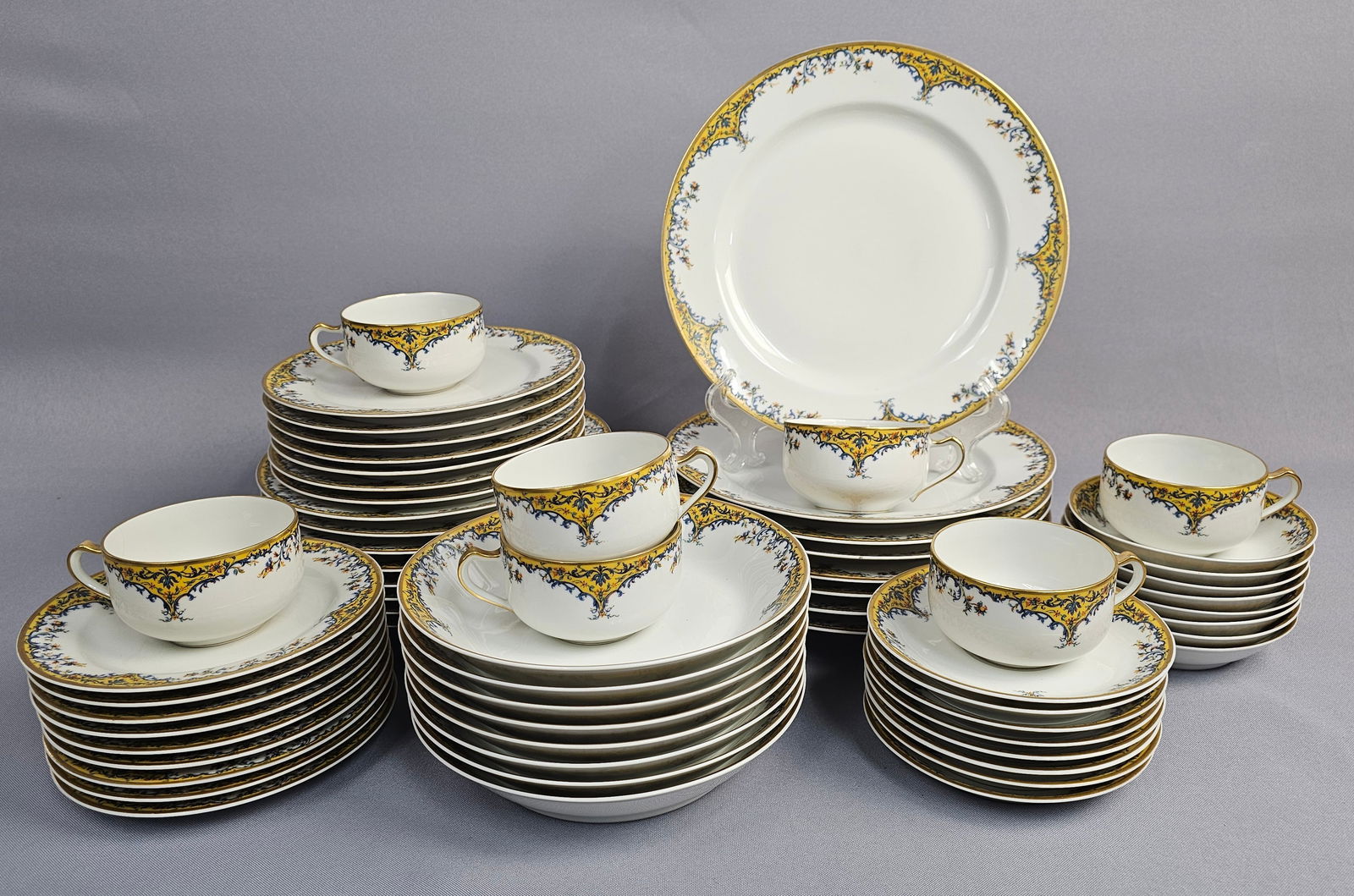 A Collection of Haviland and Co. Limoges Porcelain Dinnerware in the Old Gold Pattern (1 of 16)