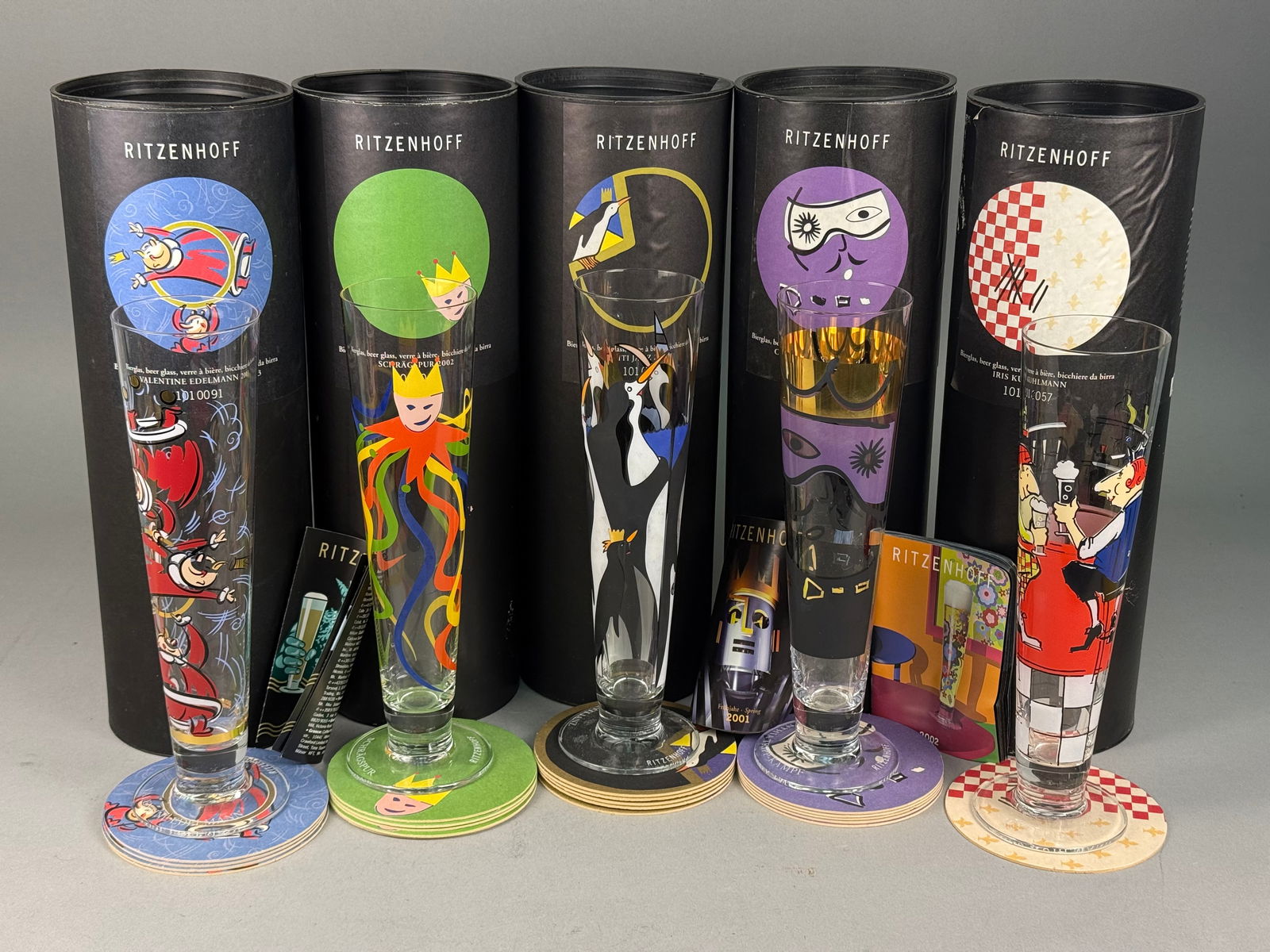 A Collection of Ritzenhoff Designer Pilsner Beer Glasses: A collection of Ritzenhoff designer pilsner-style beer glasses. Each vessel is constructed of clear glass and features graphic illustrations by various artists. The collection includes designs by Vale