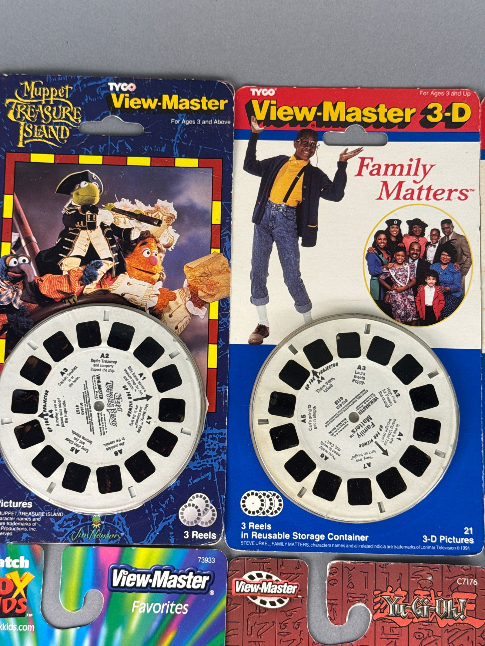 A Collection of Tyco and Fisher-Price View-Master 3-D Reel Sets: A collection of View-Master 3-D reel sets manufactured by Tyco and Fisher-Price, dating from the early 1990s through the early 2000s. The group features various popular entertainment franchises includ