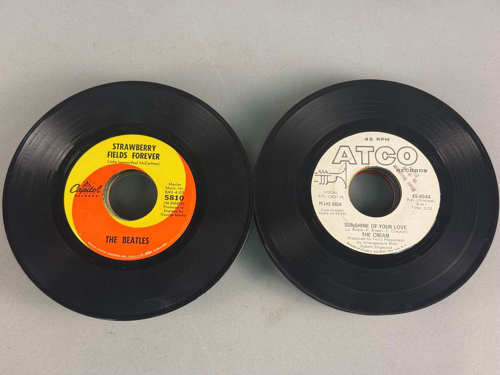 A Collection of 7-Inch 45 RPM Vinyl Records Featuring The Beatles, Cream, and Others (1 of 4)
