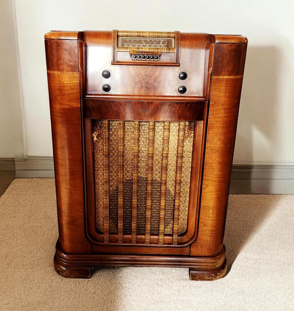 Philco Art Deco Floor-Standing Radio & Phonograph Console: This Philco floor-standing radio and phonograph console dates from the late 1930s to early 1940s. The unit is housed in an Art Deco-style wooden cabinet featuring veneers and vertical slats positioned