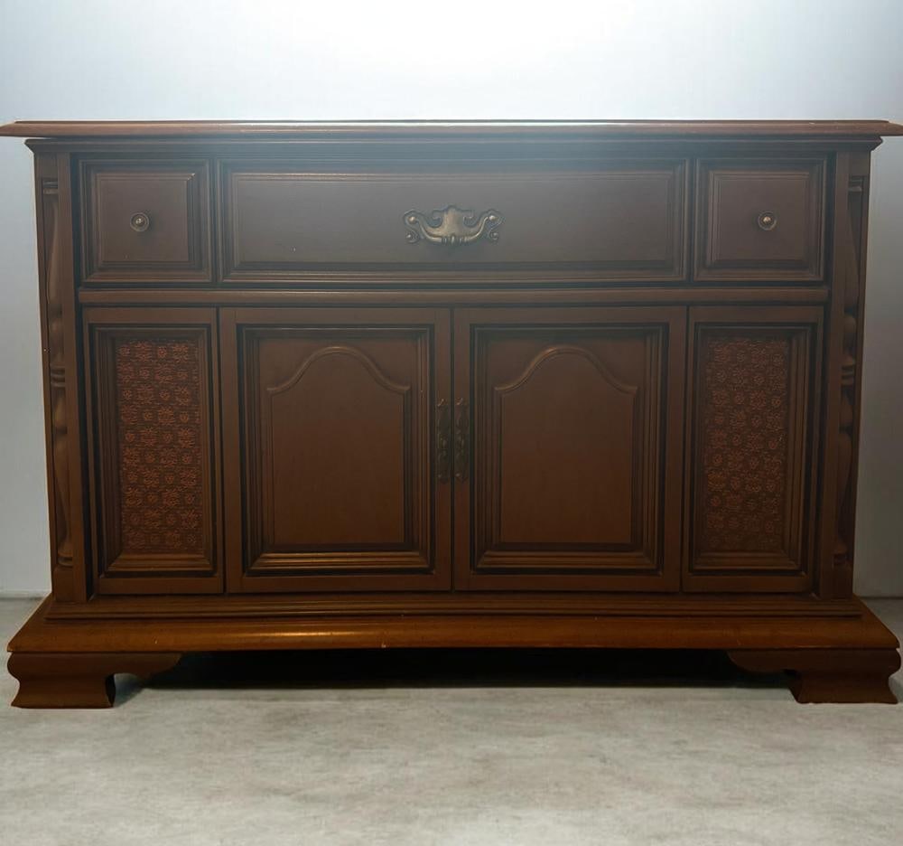 1974 Magnavox Console Record Player and 8-Track Stereo System: This item is located on the second floor. A 1974 Magnavox console stereo system featuring a dark-finished wood cabinet with Mediterranean-style design elements. The unit is constructed with a sliding