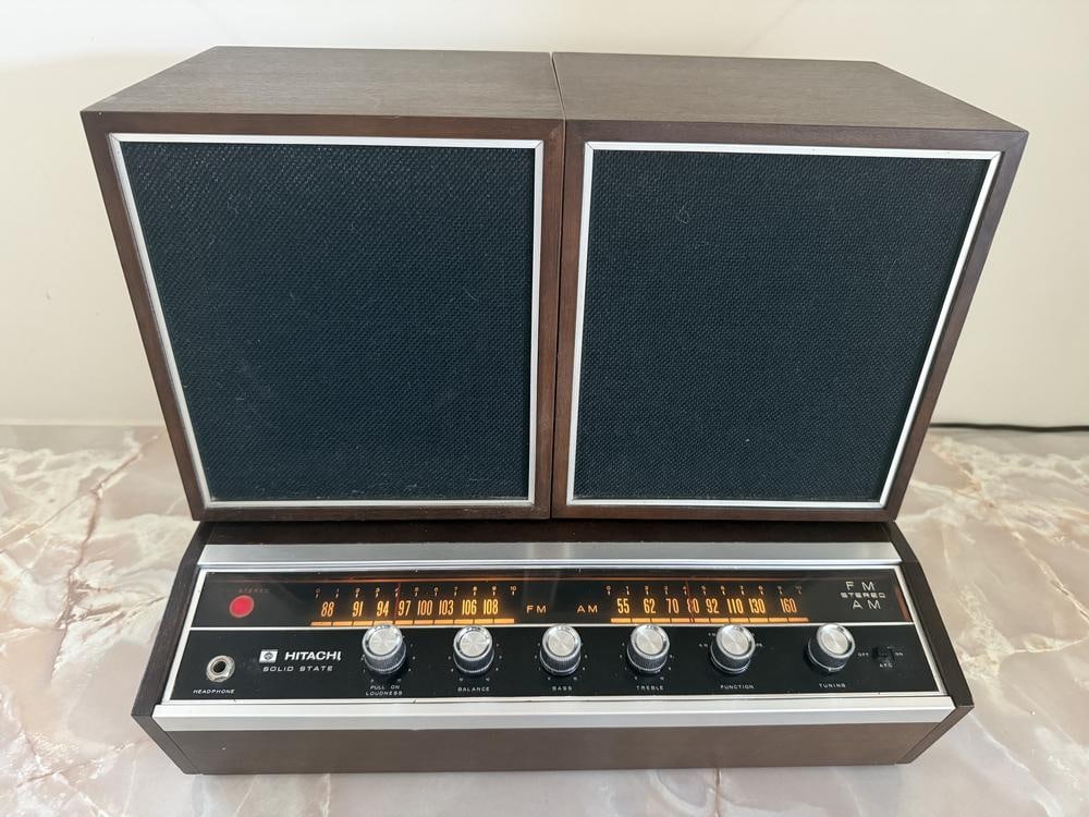 A Hitachi Solid State FM/AM Stereo Receiver with a Pair of Matching Speakers, Model KS-2200H: This item is located on the second floor. A Hitachi solid state FM/AM stereo receiver, model KS-2200H, with a pair of matching speakers. The components feature mid-century modern styling with dark
