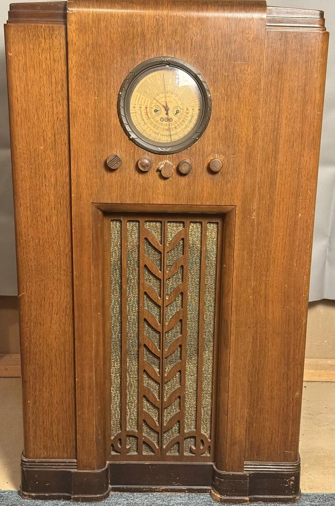 Montgomery Ward Airline Model 62-192 Art Deco Console Radio: This item is located in the basement. This Montgomery Ward Airline console radio, model 62-192, features an upright Art Deco style wooden cabinet dating from the late 1930s. The unit is designed with