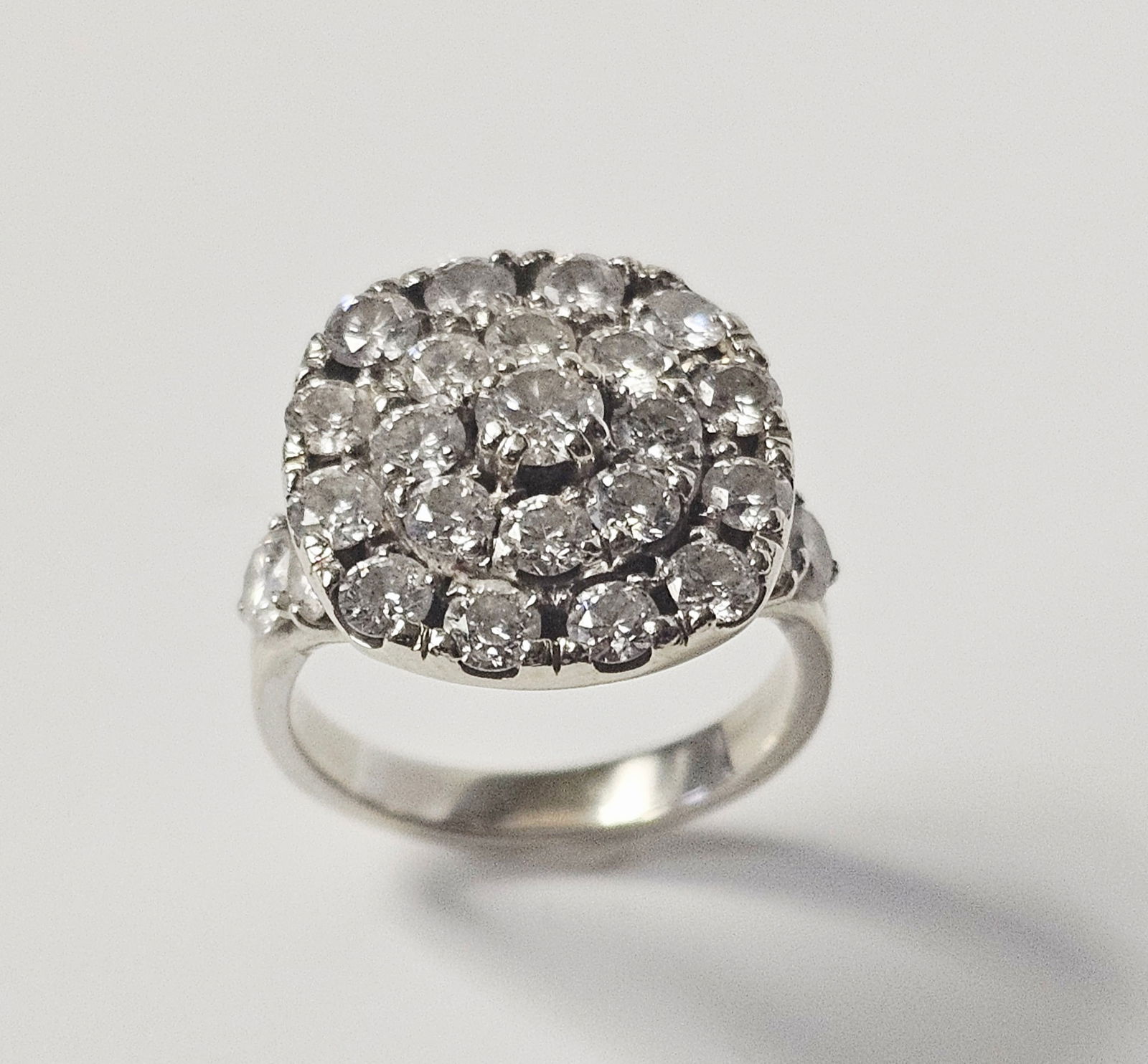 14K Gold and 2.38 Carat Diamond Cluster Ring 6.8 Grams: A custom CAD-designed ring crafted in 14 karat white gold, featuring a prominent tiered circular cluster head. The piece is densely set with twenty-seven round brilliant-cut diamonds with a total
