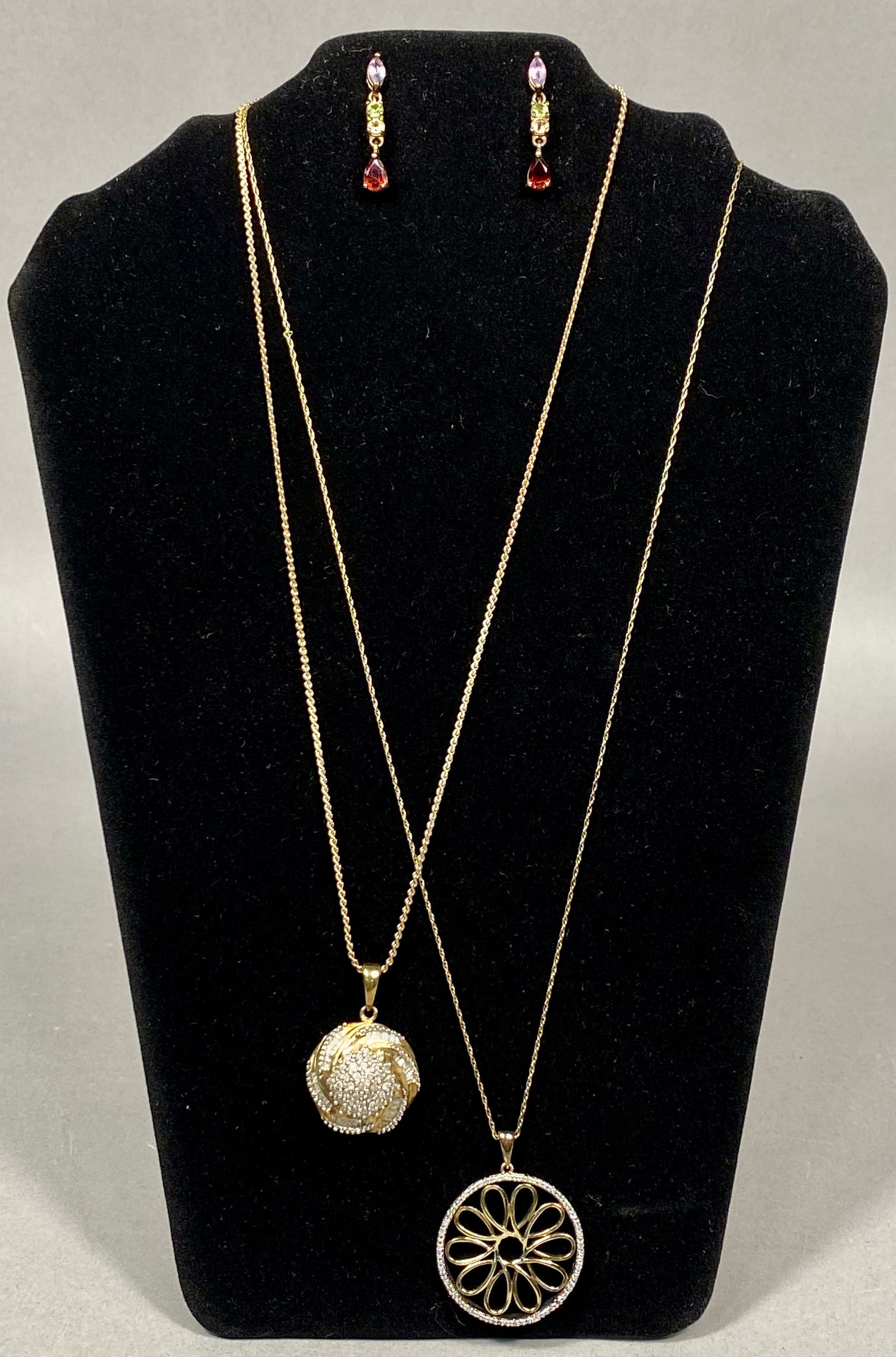 Gold-Plated Sterling Silver Jewelry Collection, Three Pieces with Multi-Color Gemstones and Cubic: This jewelry collection consists of three pieces crafted in gold-plated sterling silver. The first item is a pair of multi-color gemstone linear drop earrings, featuring graduated faceted stones inclu