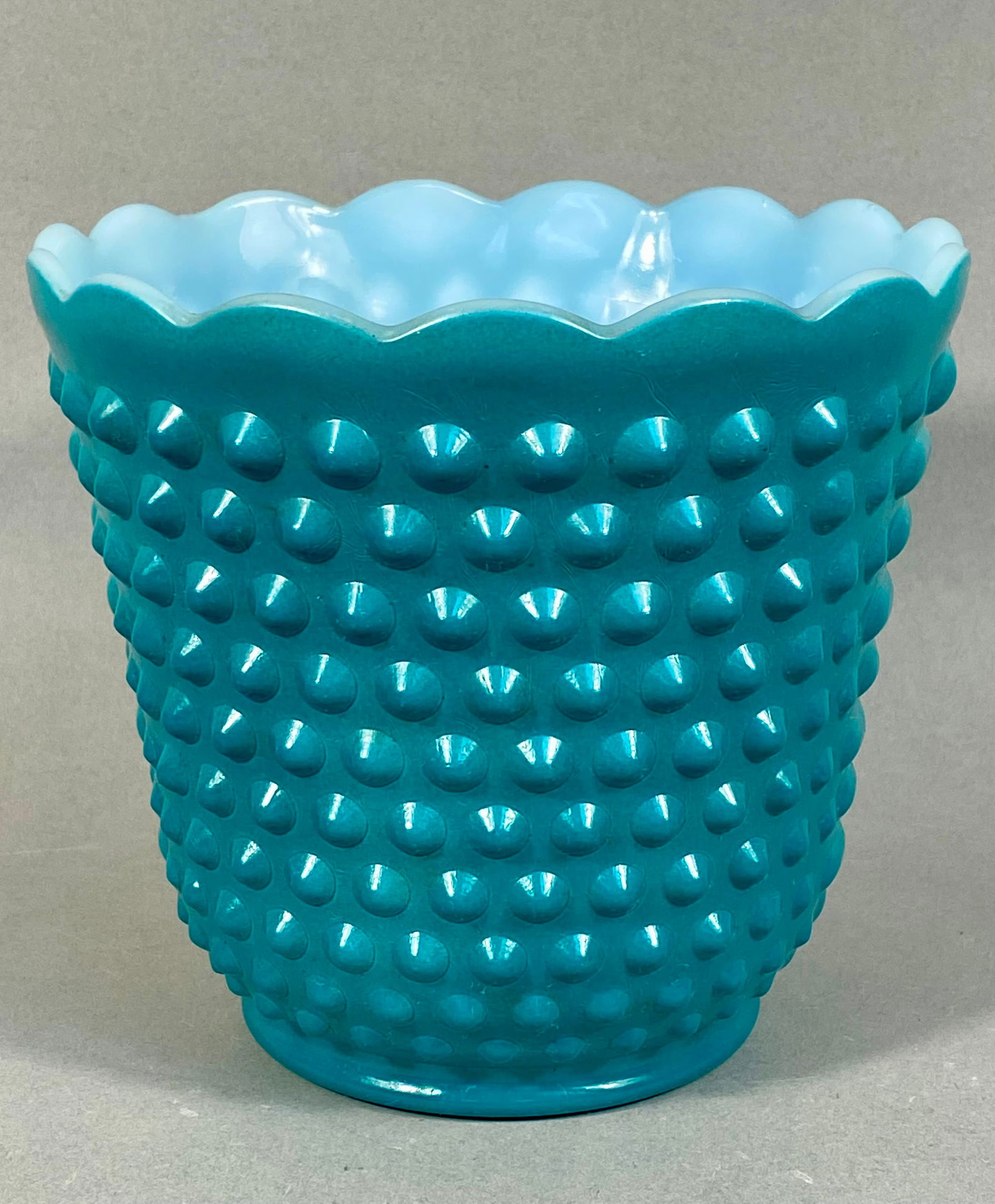 Fire-King, Hobnail Glass Planter, Mid-Century: Manufactured by Fire-King (Anchor Hocking), this mid-century decorative planter is crafted from opaque milk glass with a turquoise fired-on enamel exterior finish. The vessel features a traditional ho